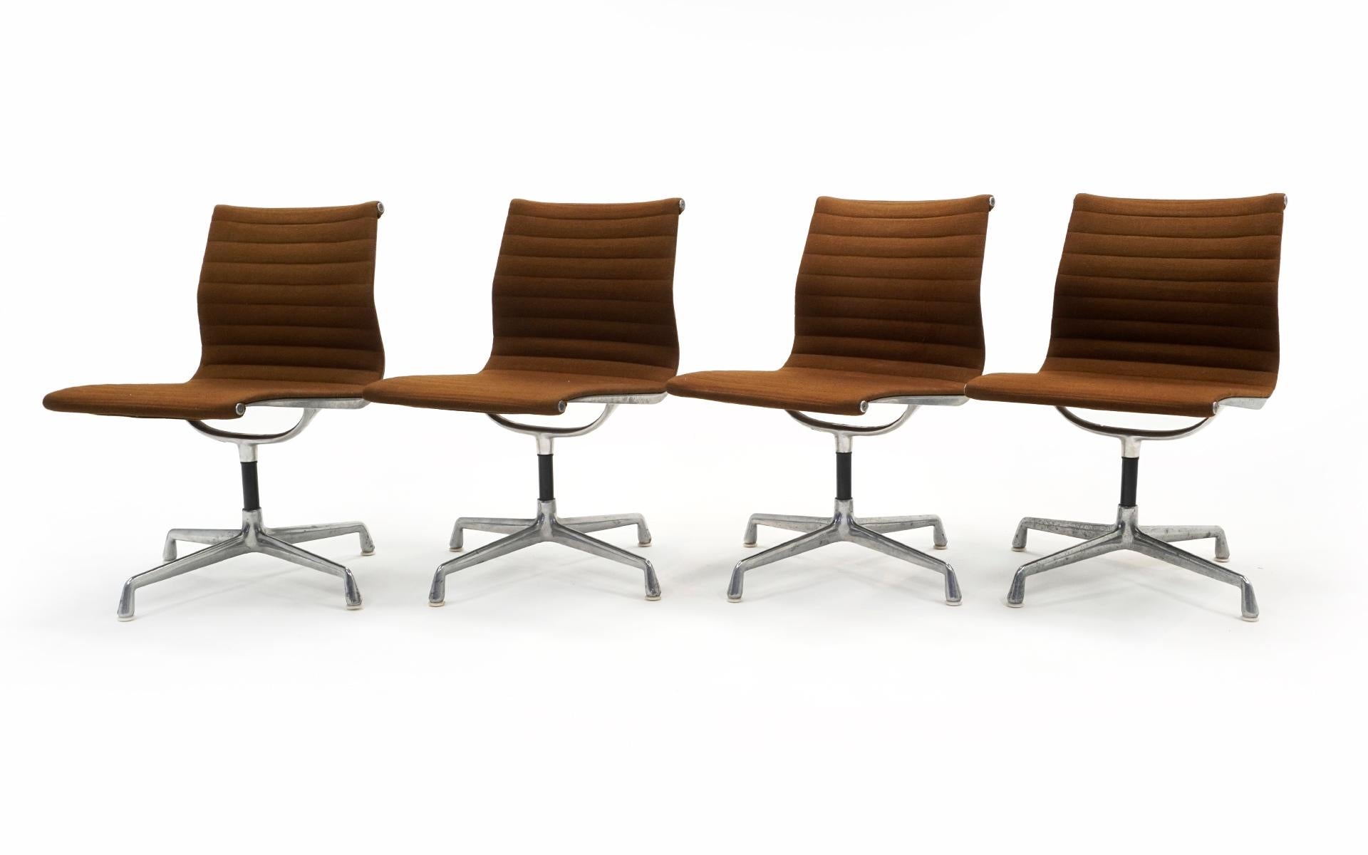 Mid-Century Modern Charles & Ray Eames Armless Aluminum Group Swivel Chairs. Aluminum, Brown Fabric