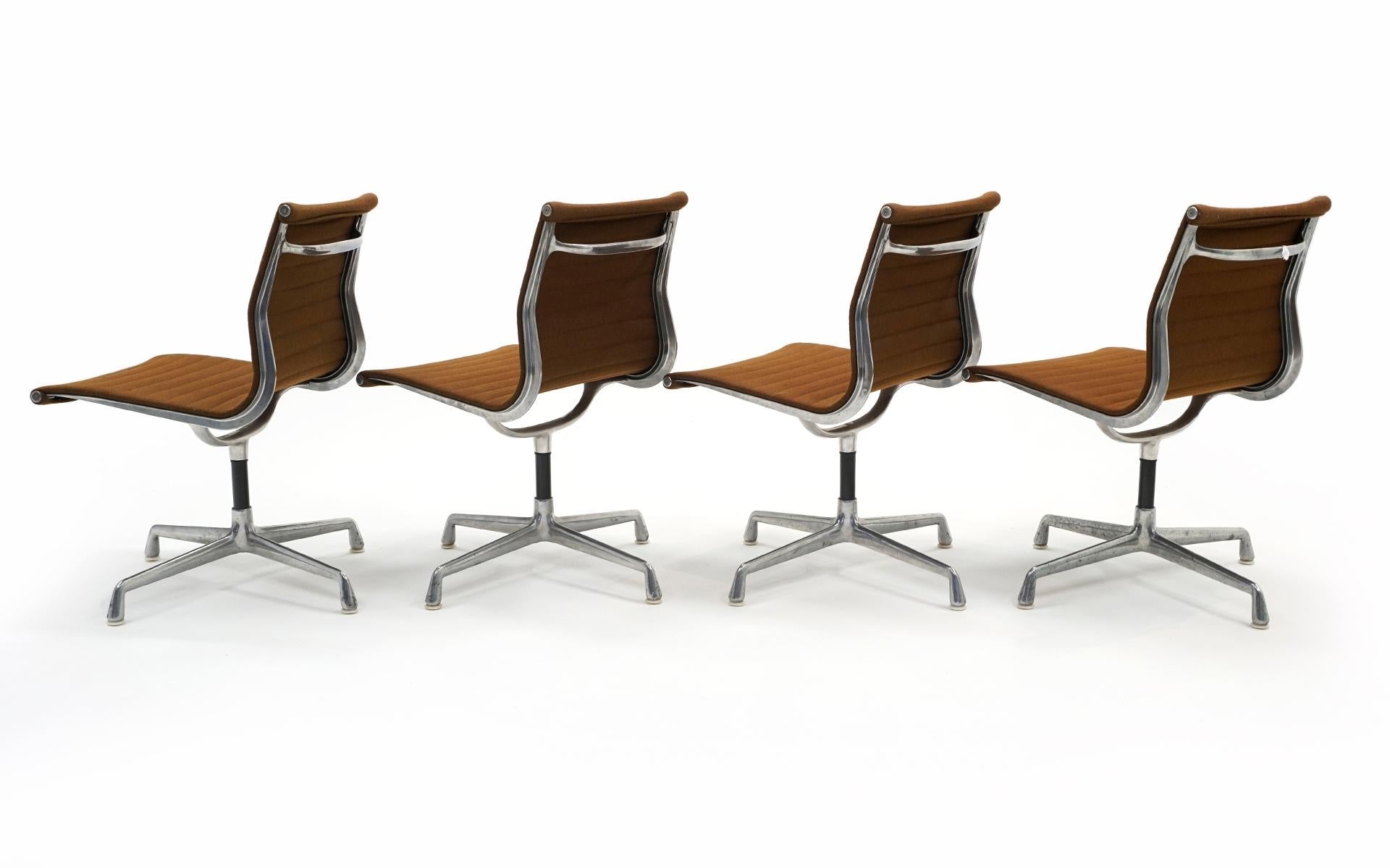 Charles & Ray Eames Armless Aluminum Group Swivel Chairs. Aluminum, Brown Fabric In Good Condition In Kansas City, MO