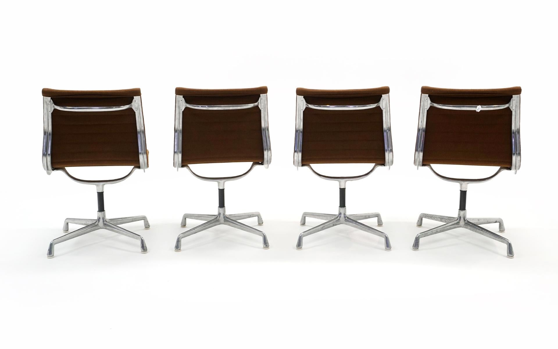 Late 20th Century Charles & Ray Eames Armless Aluminum Group Swivel Chairs. Aluminum, Brown Fabric