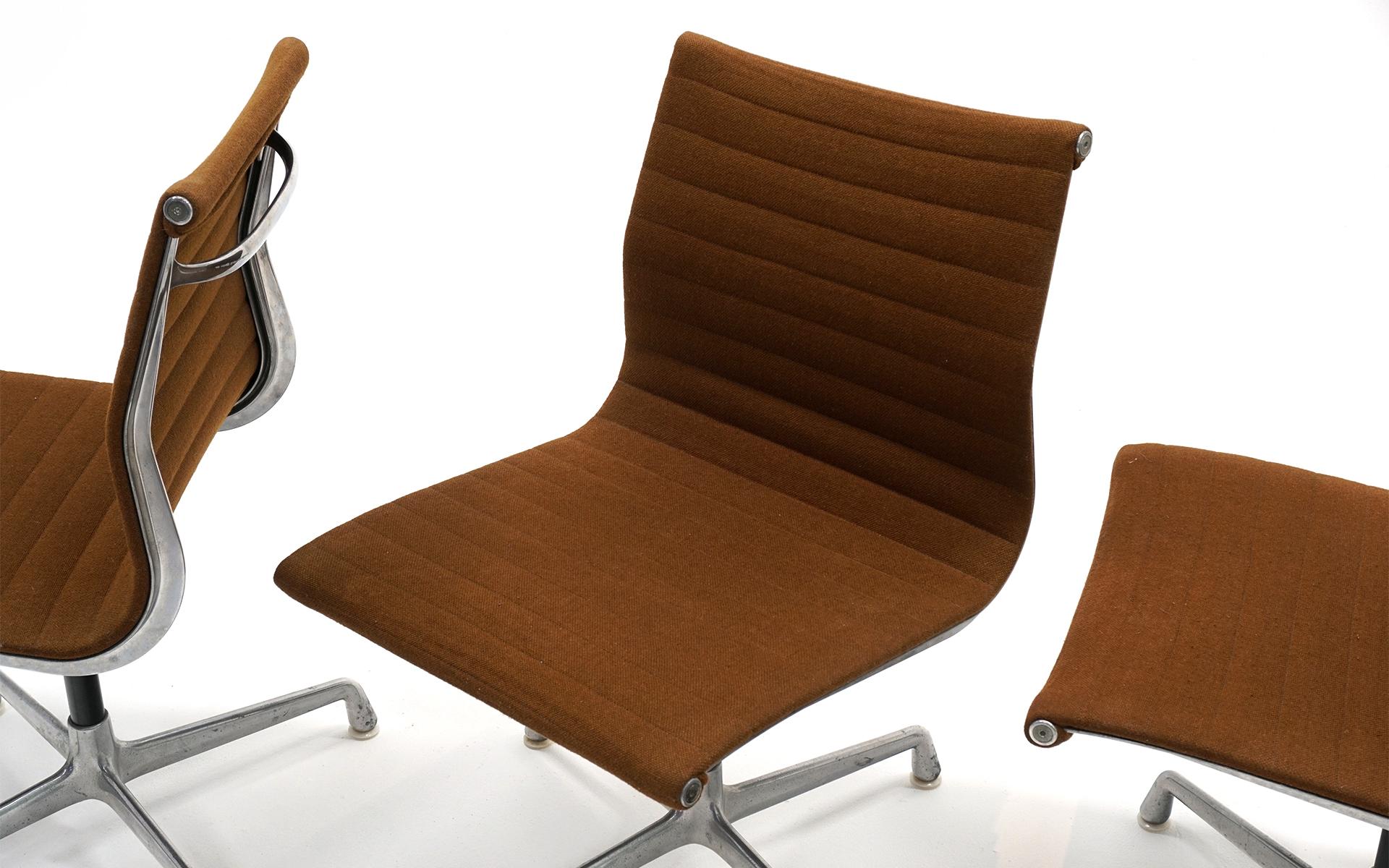 Charles & Ray Eames Armless Aluminum Group Swivel Chairs. Aluminum, Brown Fabric 1