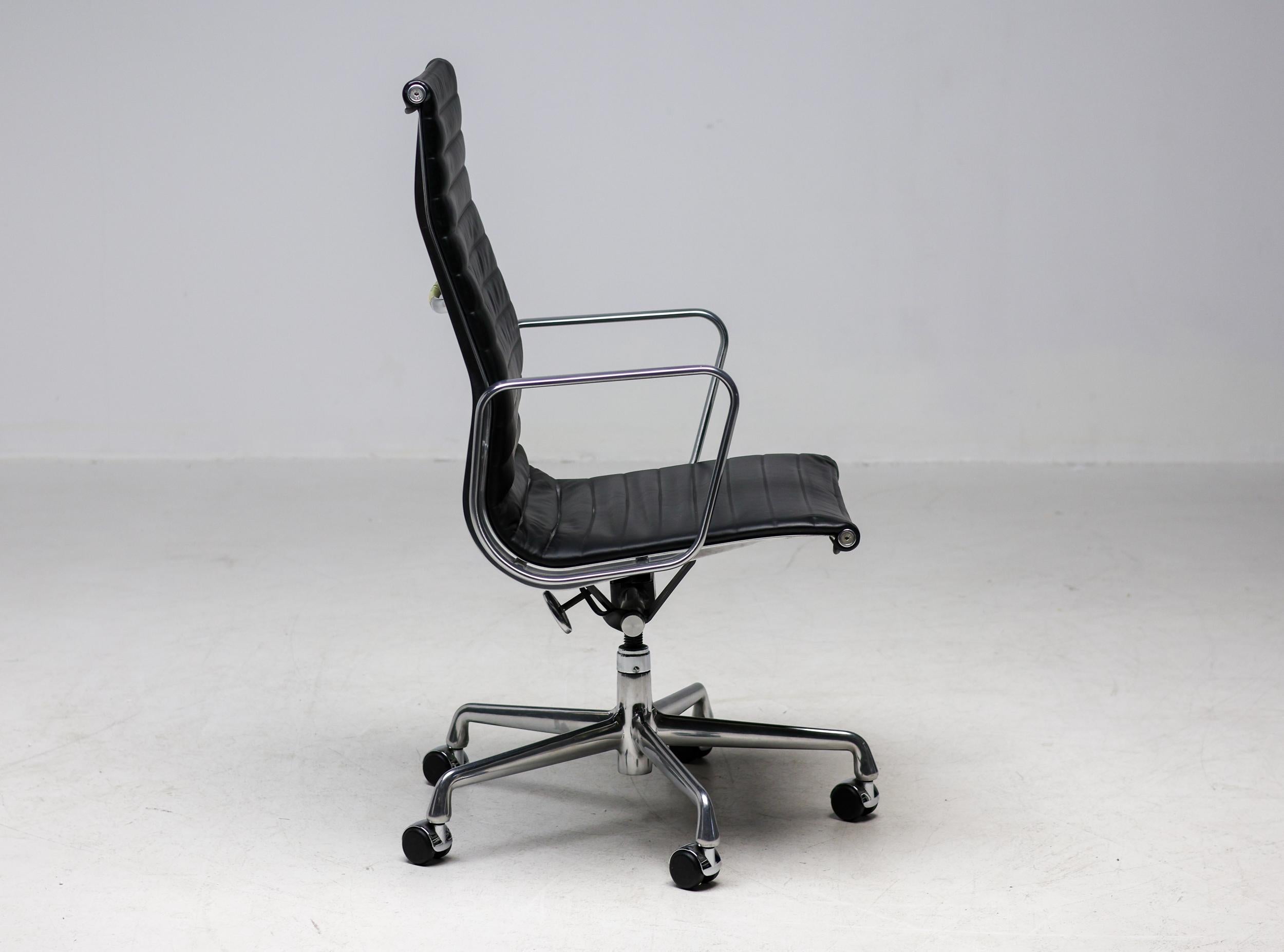 Executive office chair, model EA119, in the USA known as EA337, designed by Charles and Ray Eames for Herman Miller. Backrest and seat in black leather, both front and rear. Frame, armrests and five-star base in die-cast aluminium. Seat mechanism