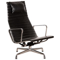 Vintage Charles & Ray Eames EA124 Aluminum Lounge Chair in Black Leather by Vitra