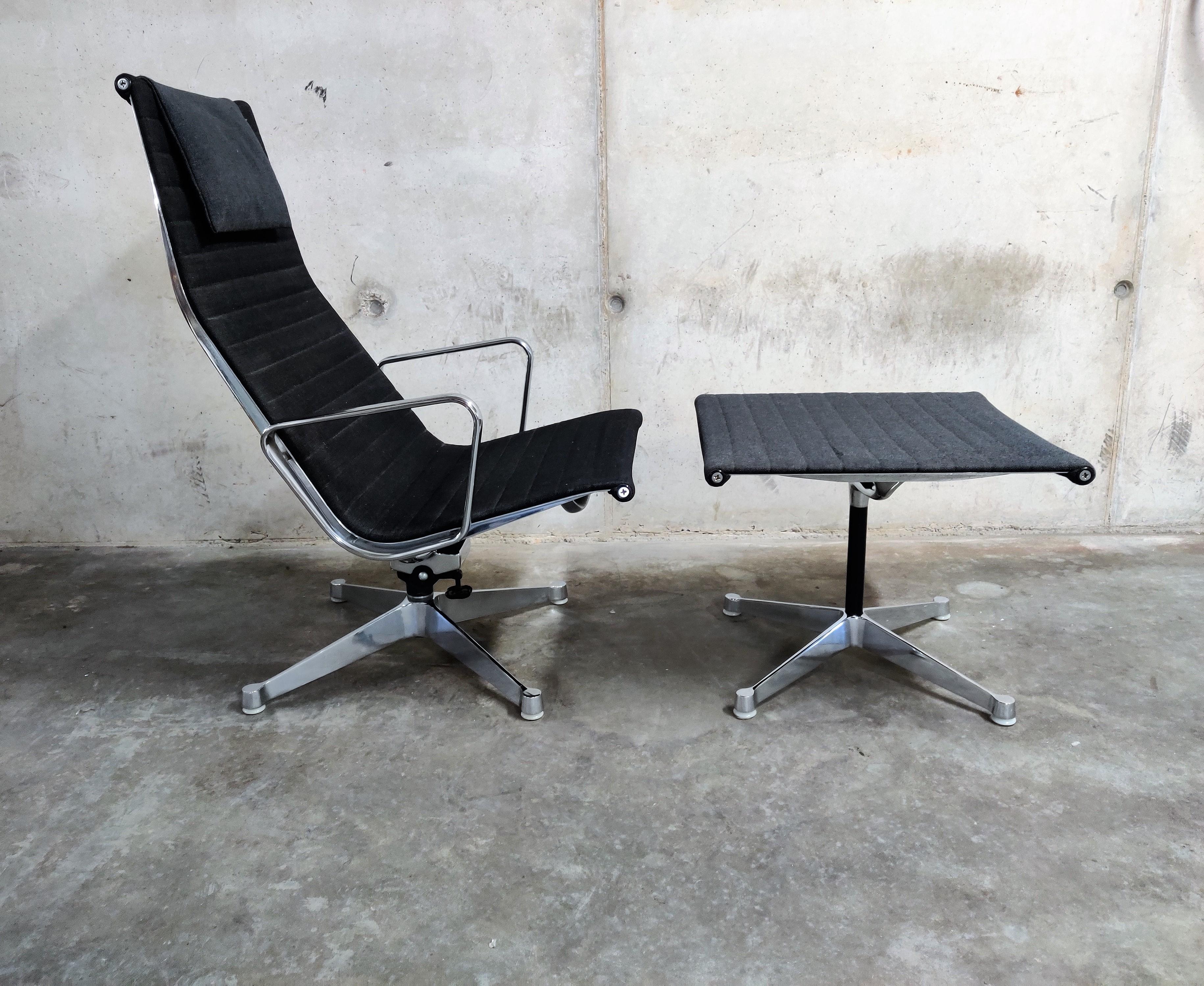 Elegant and timeless Eames EA124 swivel chair with matching EA125 ottoman.

The set is upholstered in the original black fabric.

The chair has a tilt mechanism for maximum comfort.

Good condition, only minor wear on one of the armrests and a