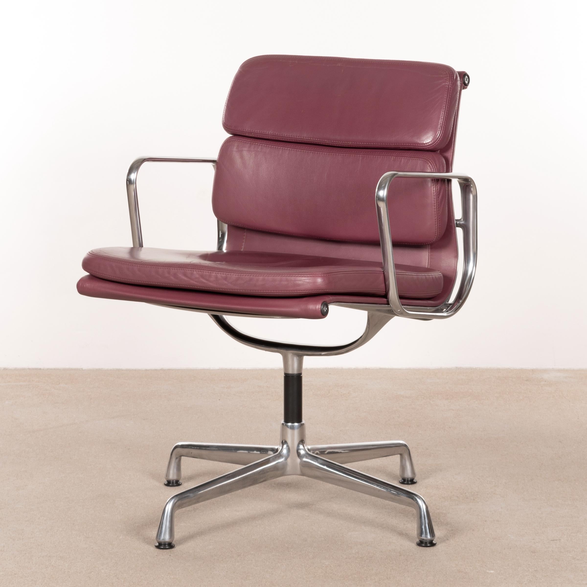 Comfortable Soft Pad set of 12 chairs designed by Charles & Ray Eames in 1969 and manufactured by Vitra. Polished aluminum frames with swivel function with leather cushions in an aubergine / purple tone. Backside also in leather which is optional in