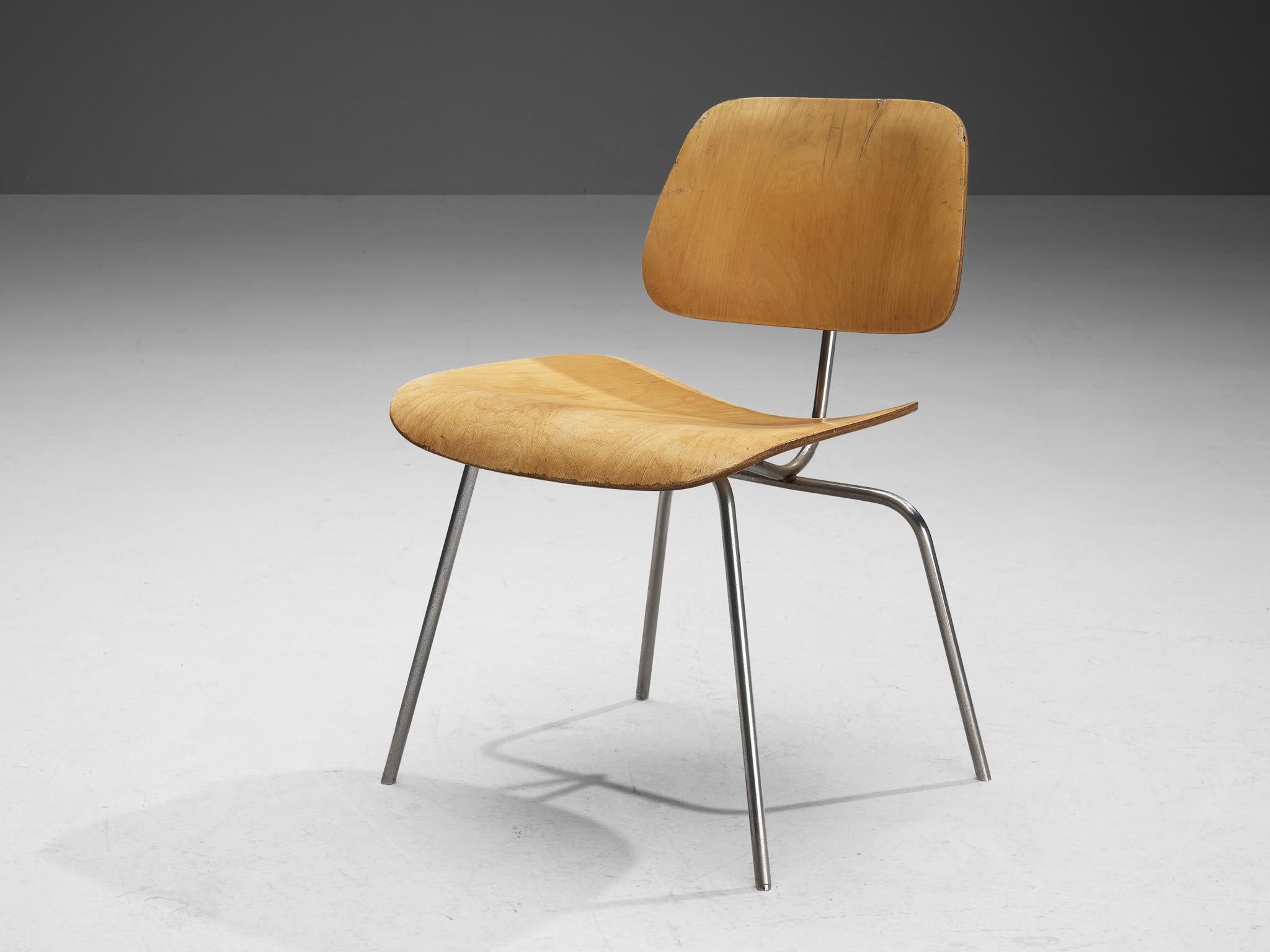 Charles & Ray Eames for Herman Miller, chair, plywood, United States, design 1946.

Classic DCM (Dining Chair Metal) by Charles and Ray Eames with birch plywood seat and back. The DCM arose in 1946 from experimenting with moulding plywood in