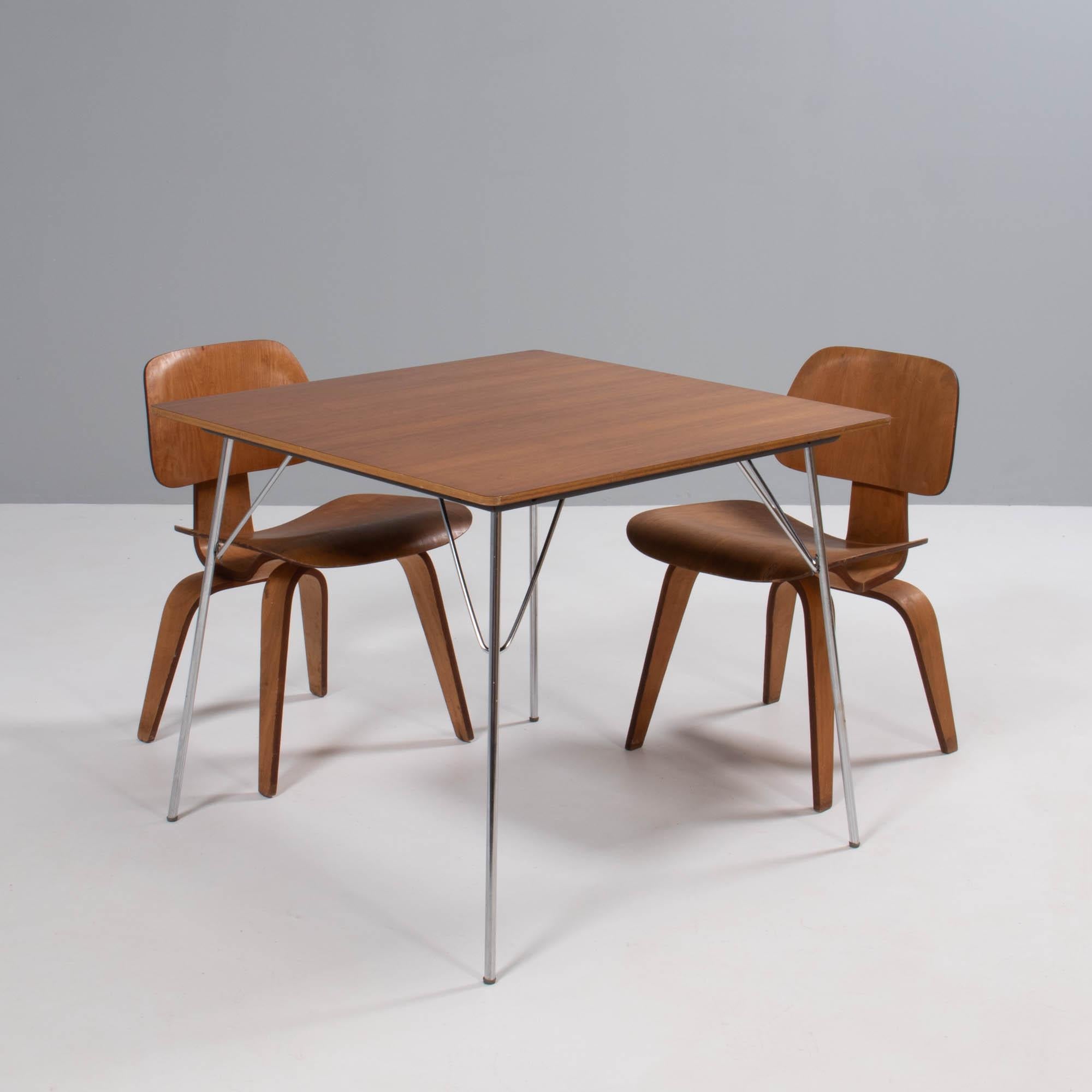 Originally released in 1947, the DTM table had four variants. The DTM-2 was the square table with a natural veneer top. Herman Miller manufactured the tables until 1964 when it was discontinued.

The ingenious design by Charles and Ray Eames