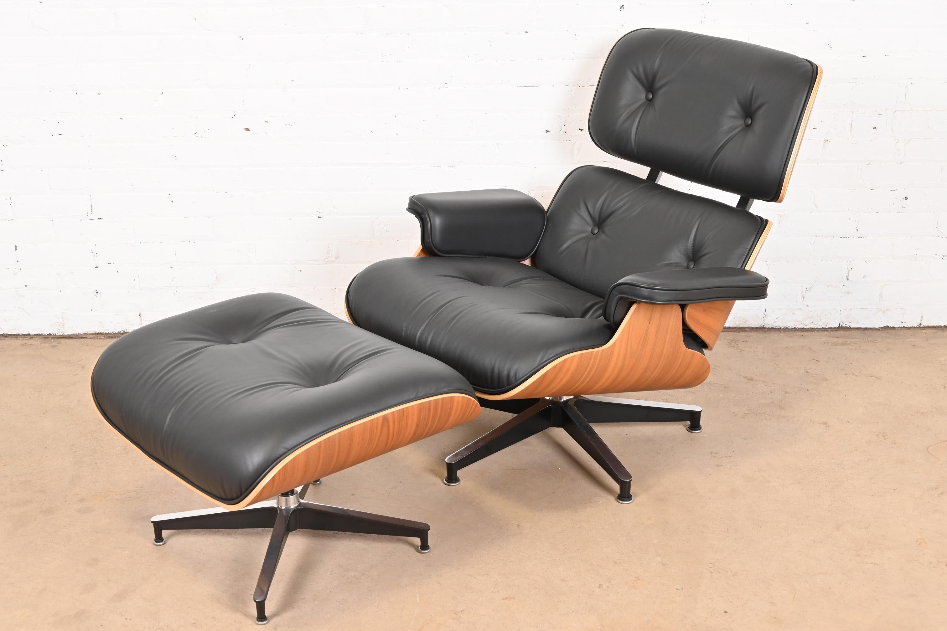 An outstanding and iconic Mid-Century Modern lounge chair with ottoman

By Charles and Ray Eames for Herman Miller

USA, Early 21st Century

Bentwood walnut frame, with black tufted leather upholstery.

Measures:
Chair - 33.25