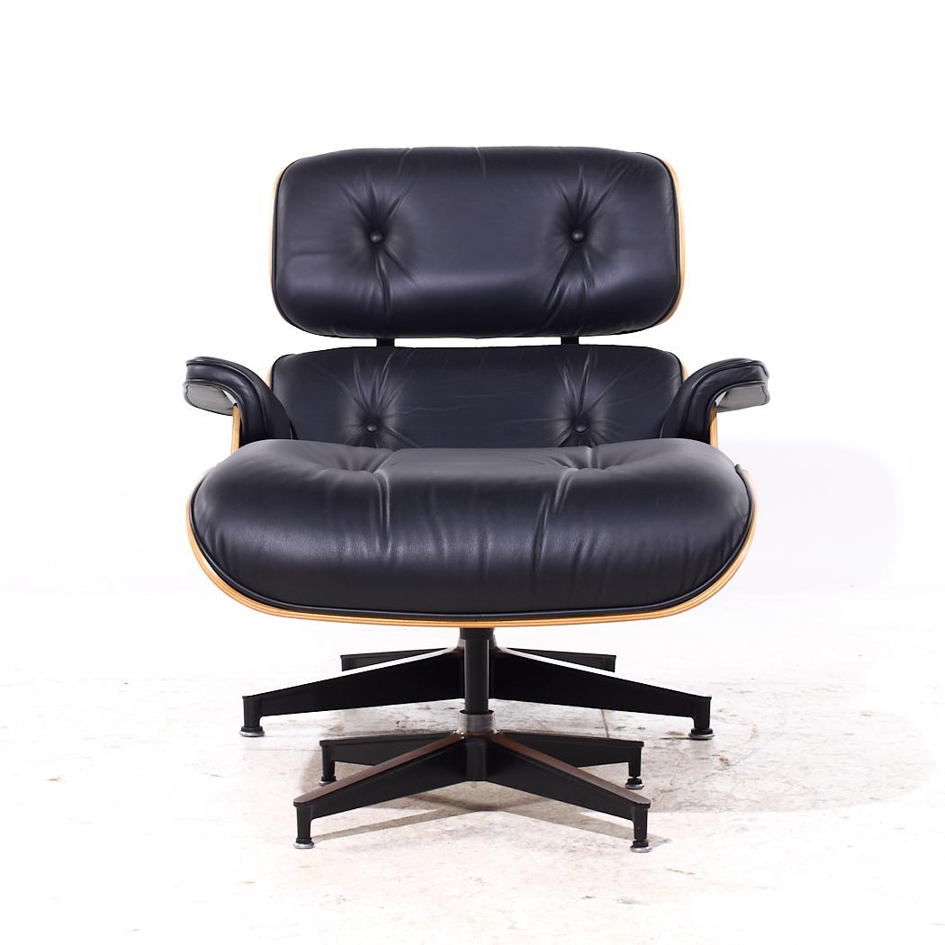 Charles and Ray Eames for Herman Miller Mid Century Walnut Eames Chair and Ottoman

The chair measures: 21.5 wide x 24.5 deep x 40.75 high, with a seat height of 20.5 inches and arm height/chair clearance of 20.75 inches
The ottoman measures: 26