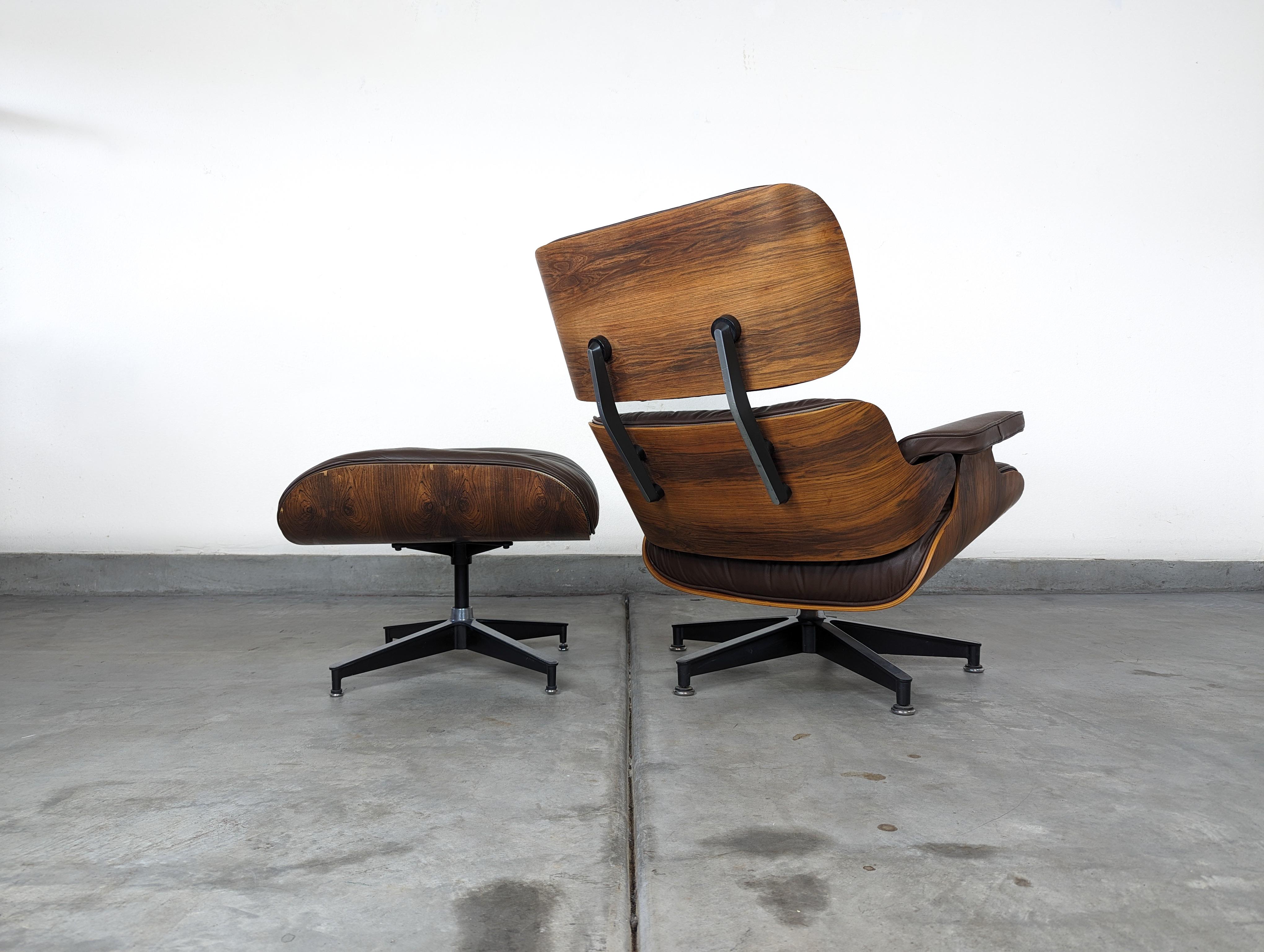 Step into a world of timeless elegance and unparalleled comfort with this authentic mid-century Rosewood Eames Lounge Chair (model #670) and matching ottoman (model #671), a highly sought-after collector's item designed by the iconic duo Ray and