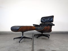Charles and Ray Eames per Herman Miller Sedia da salotto in legno di palissandro e pelle, anni '70 ca.