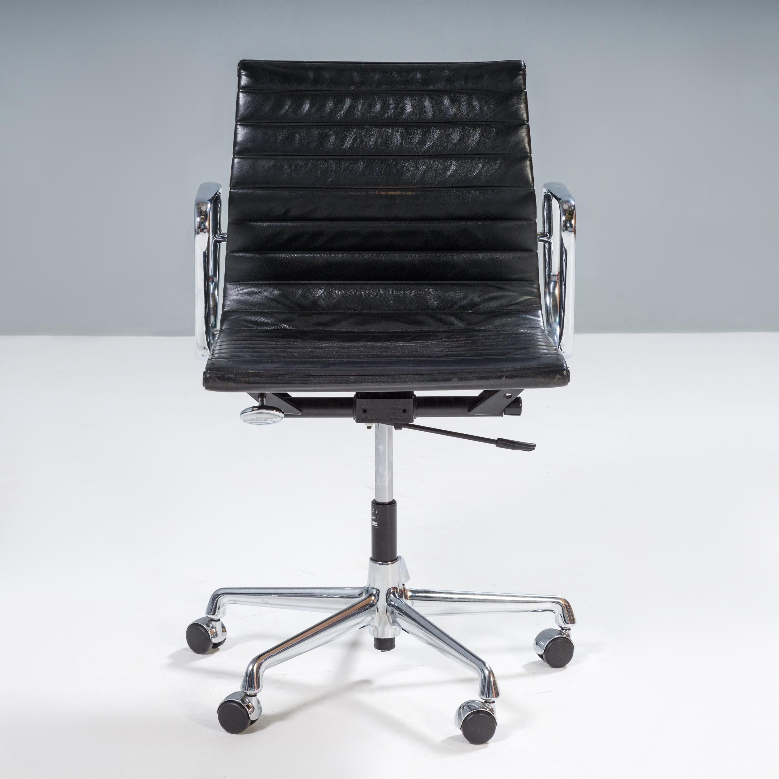 Originally designed by Charles and Ray Eames in 1958, the EA 117 chair has since become a design icon.

The chair features an aluminium frame and armrests with black leather sling seats. The leather is horizontally padded for extra comfort and