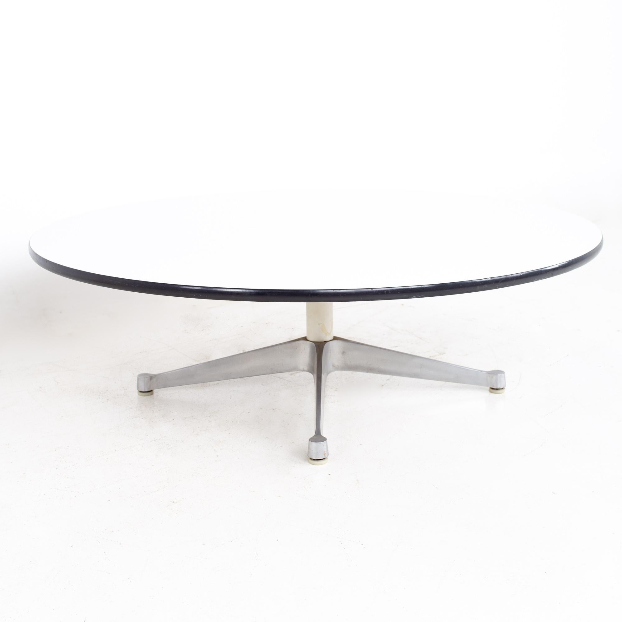 Charles and Ray Eames for Herman Miller Aluminum Group mid century round laminate and stainless coffee table.
Coffee table measures: 47.5 wide x 47.5 deep x 15.5 inches high

All pieces of furniture can be had in what we call restored vintage