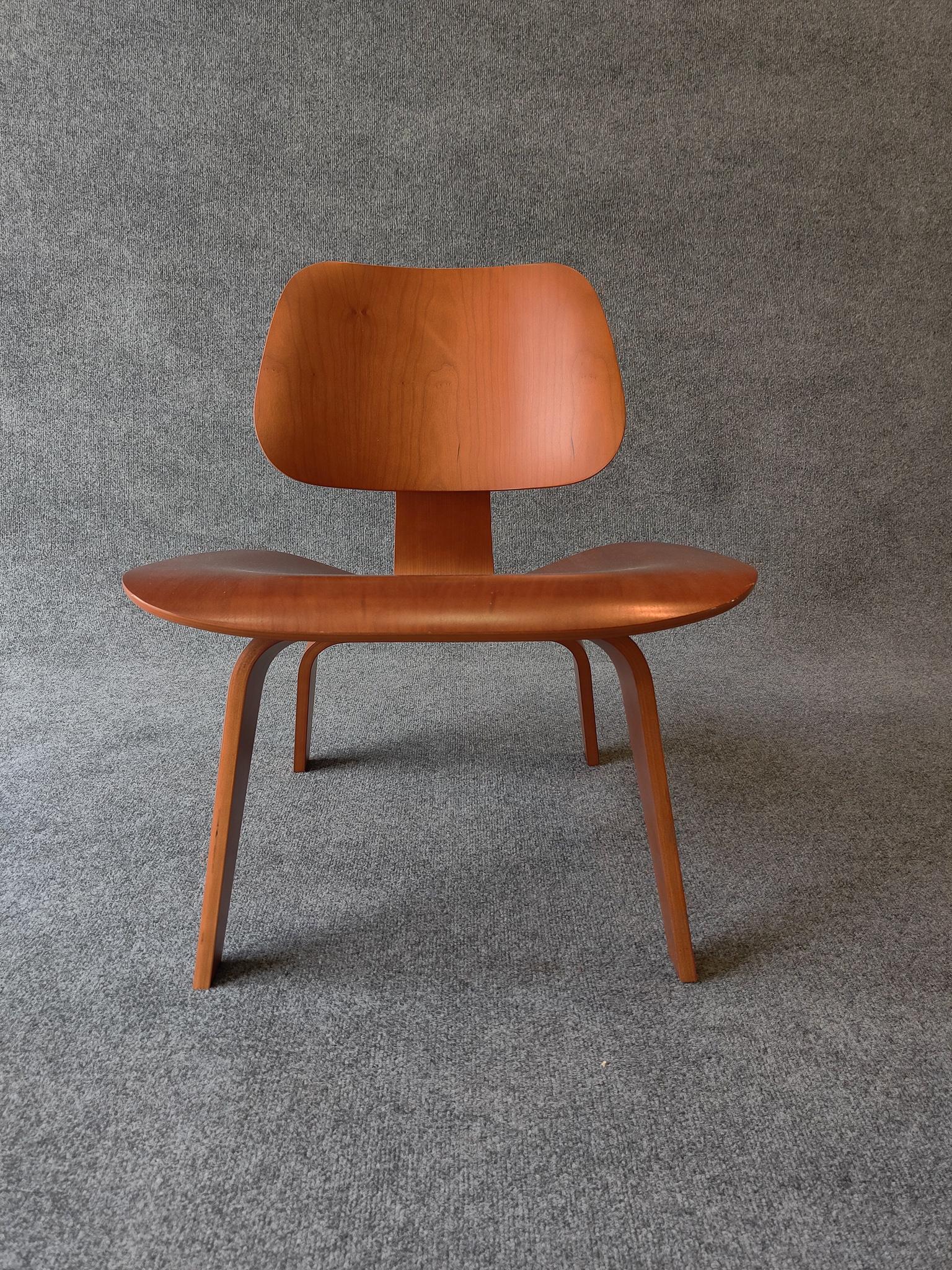 Iconic Eames LCW lounge chair in cherry plywood. Signed and dated. Super comfortable. Very light normal wear to seat area.