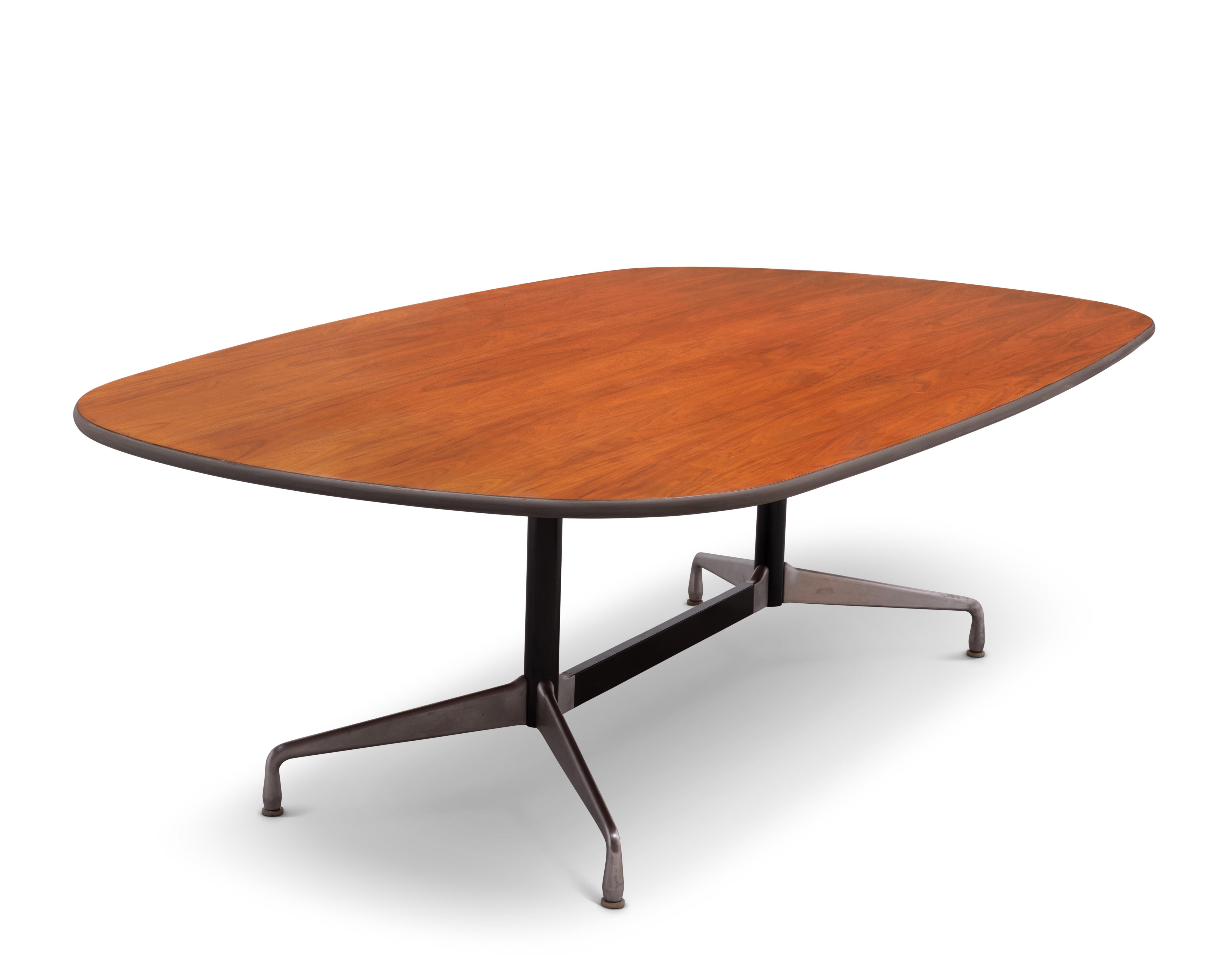 Eight foot long walnut dining / conference table designed by Charles and Ray Eames and manufactured by Herman Miller. Stamped 