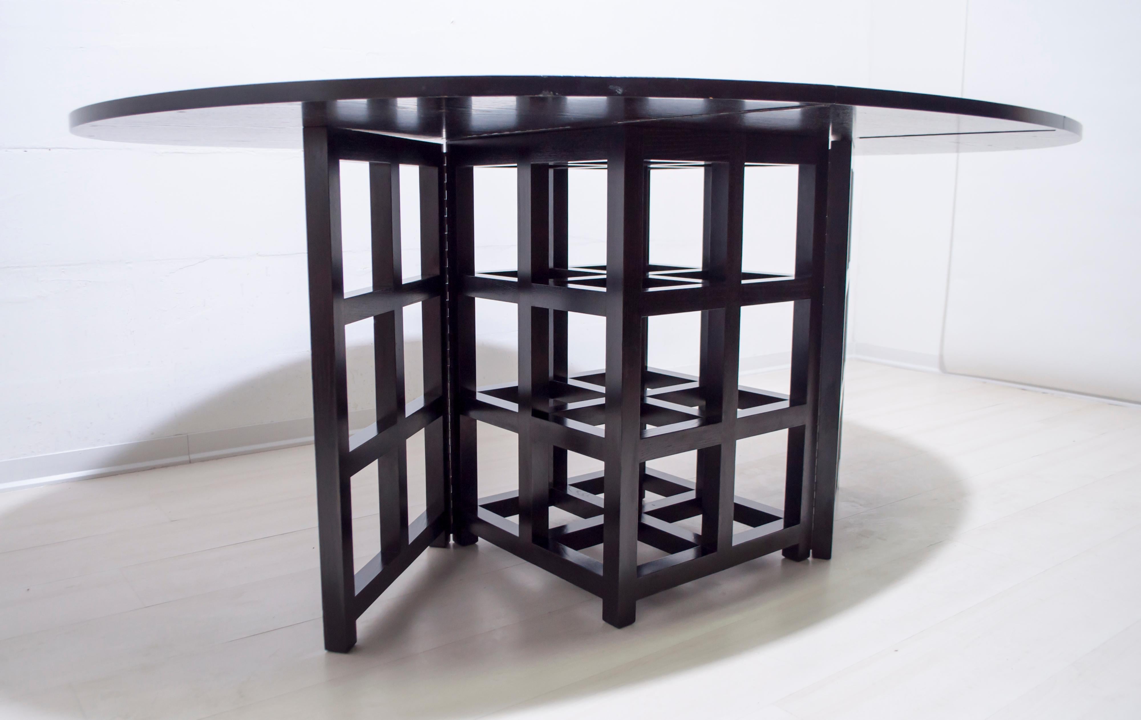 The table 322 D.S.1. It is a beautiful example of a table with a two-sided folding top, designed by the Scottish designer Charles Rennie Mackintosh in 1918 and produced by Cassina in 1975. The table, in black stained ash, is practical and