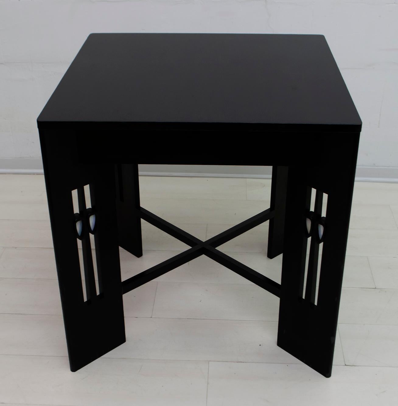 Attributed to the Scottish architect Charles Rennie Mackintosh. This side table is solidly constructed of European oak, with built-in glass pastes.