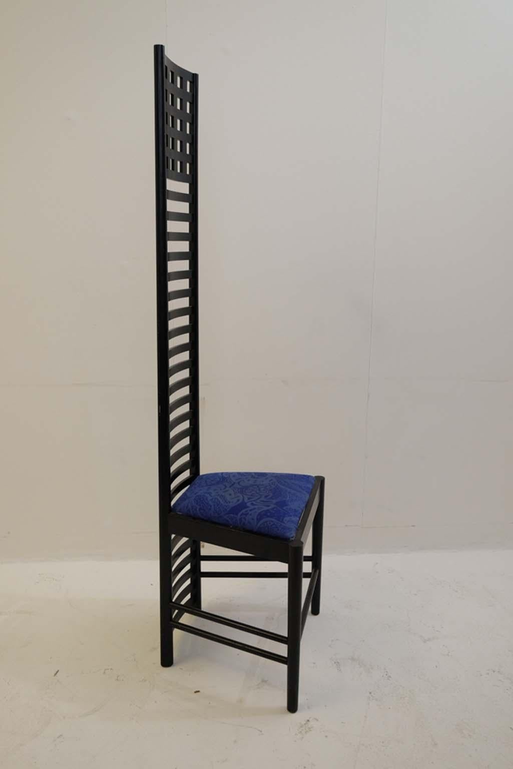 Chair with openwork back-rest in black stained ash. Upholstered seat

Linear, geometric and inspired by Japanese design for its abstract graphism. Hill House incorporates symbolic and figurative values. It is not only a chair, it is also a spatial