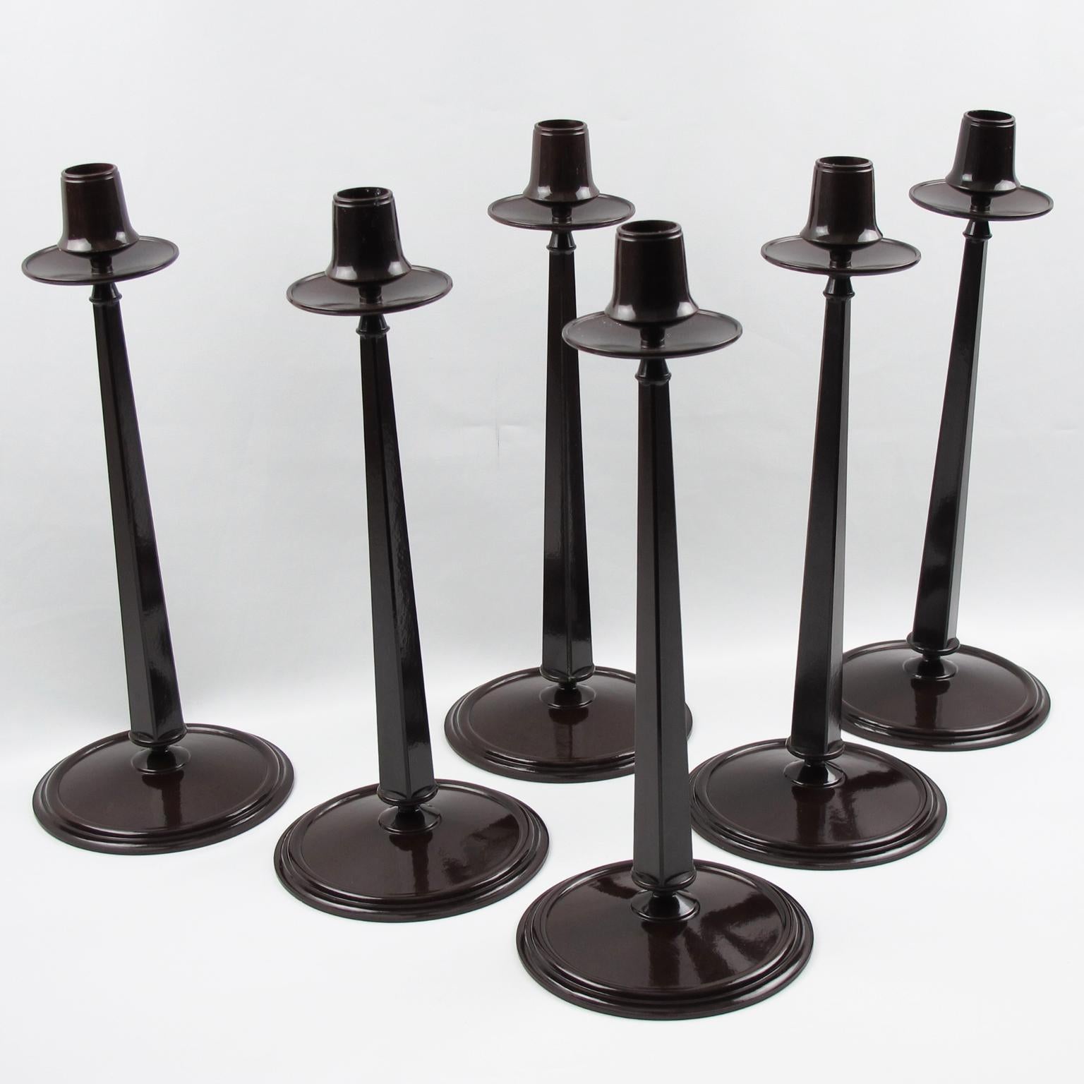This is the most iconic Bakelite piece ever. Set of six elegant Jugendstil tall tapered Bakelite candlesticks. These pieces were manufactured by Linsden Ware, England, in the late 1920s on an original design of Charles Rennie Mackintosh. The