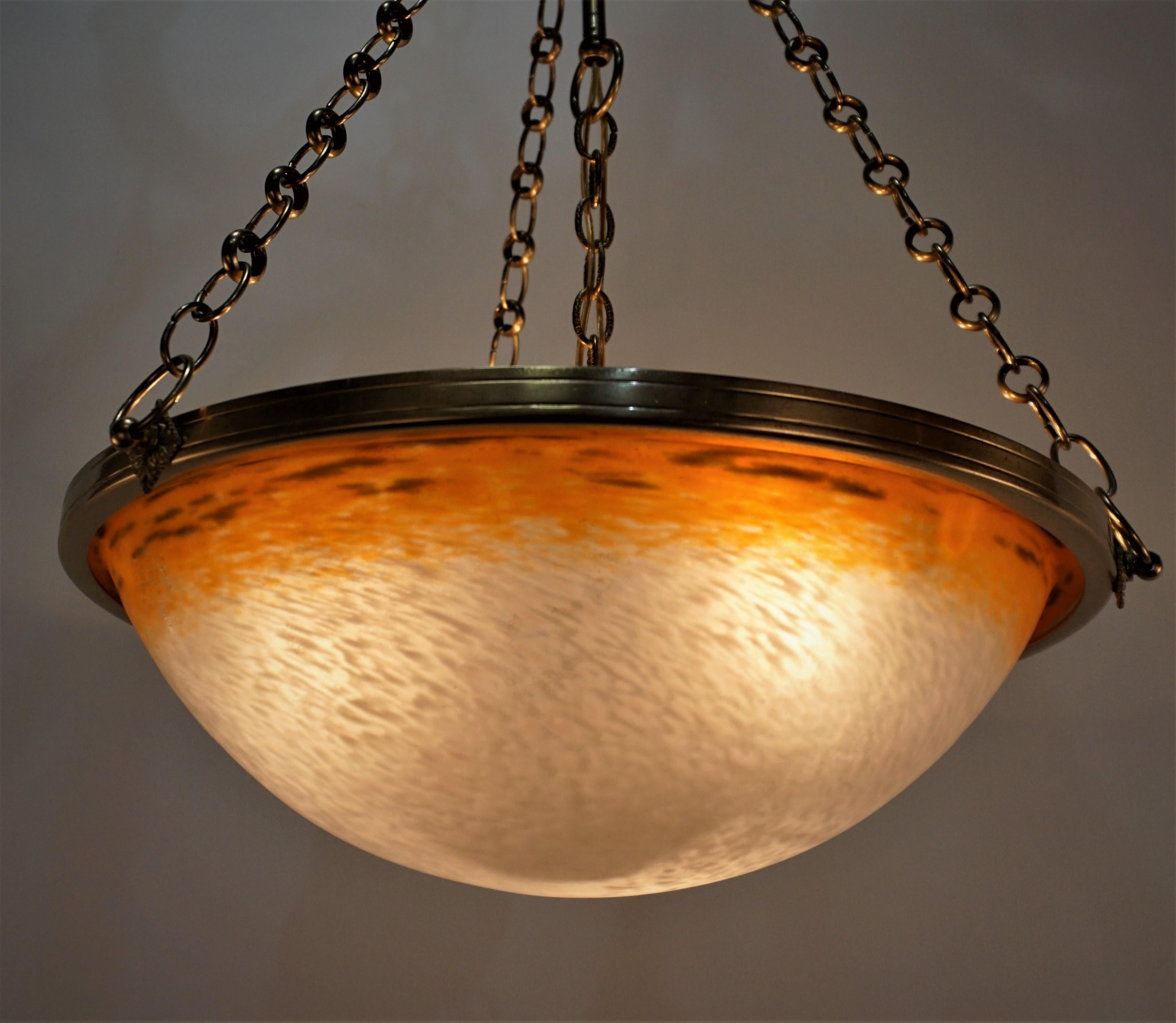 Charles Schneider blown glass in orange and textured clear/white with bronze hardware.
Professionally rewired and ready for installation.
Three lights max 100 each.