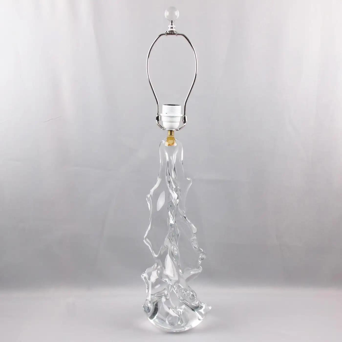 Charles Schneider France designed this lovely art Glass table or desk lamp. The mouth-blown clear crystal has an abstract design featuring a giant Christmas tree in a curved swirl-like form. The wiring was recently updated to fit US standards. The