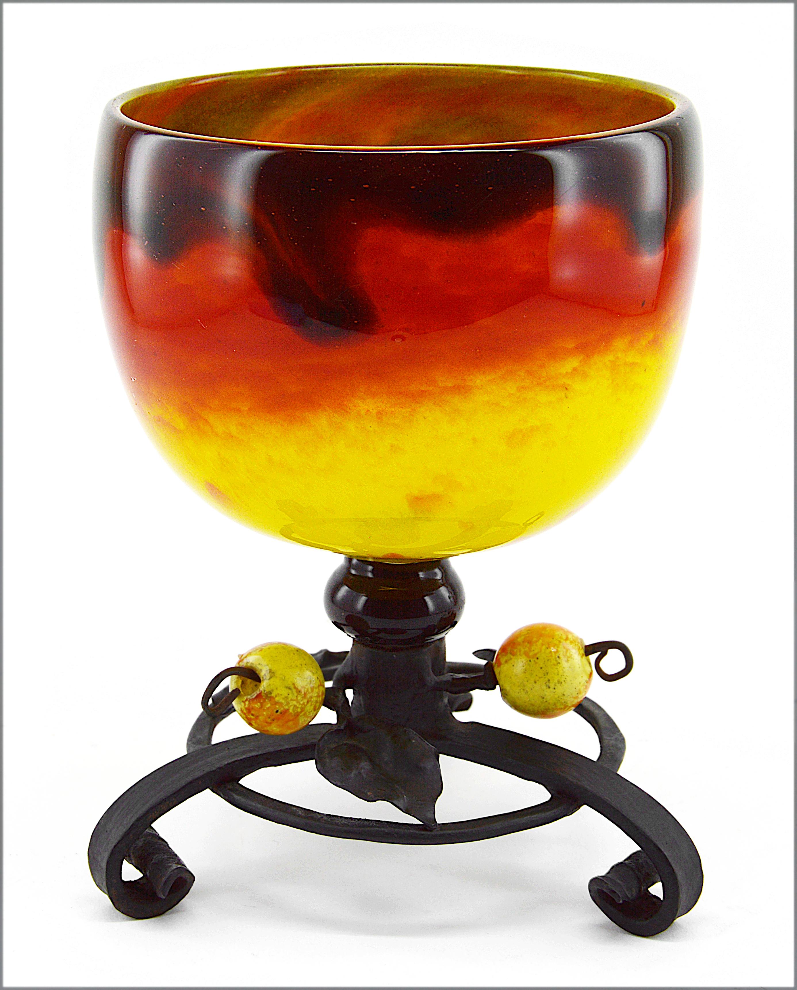 French Art Deco vase by Charles Schneider Epinay-sur-Seine (Paris), 1914-1918. Unusual vase colored with bright yellow and rich orange colors overlaid with a veil of dark brown/black. Wrought-iron base made by Schneider in a workshop of the factory
