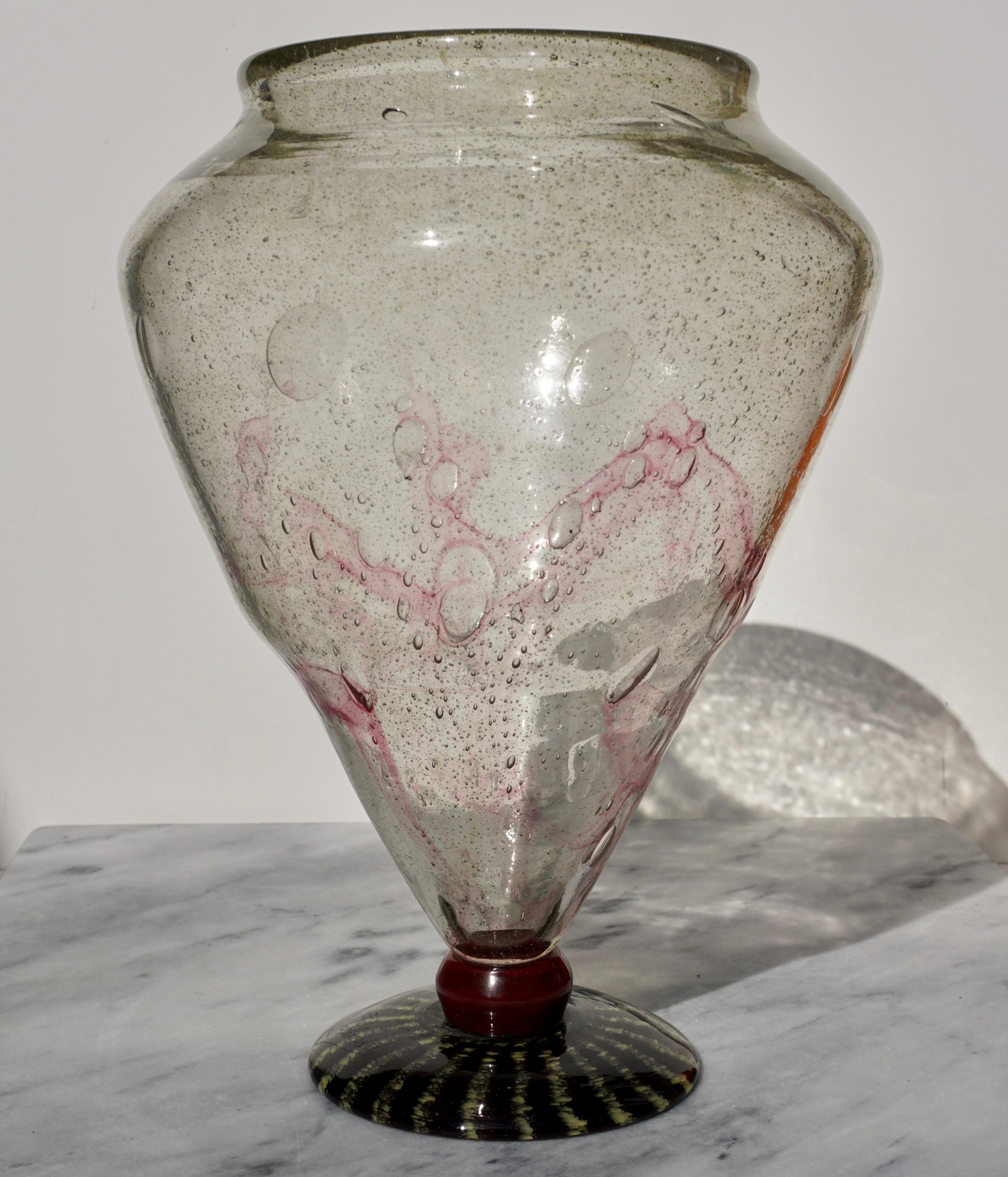 A monumental Art Deco air bubbles blown glass urn form vase in yellow and crimson cintra with a striated yellow and burgundy foot

Signed with an etched Schneider and hour glass

Measures: Height 13.5 inches
Diameter 9.75 inches

Condition: