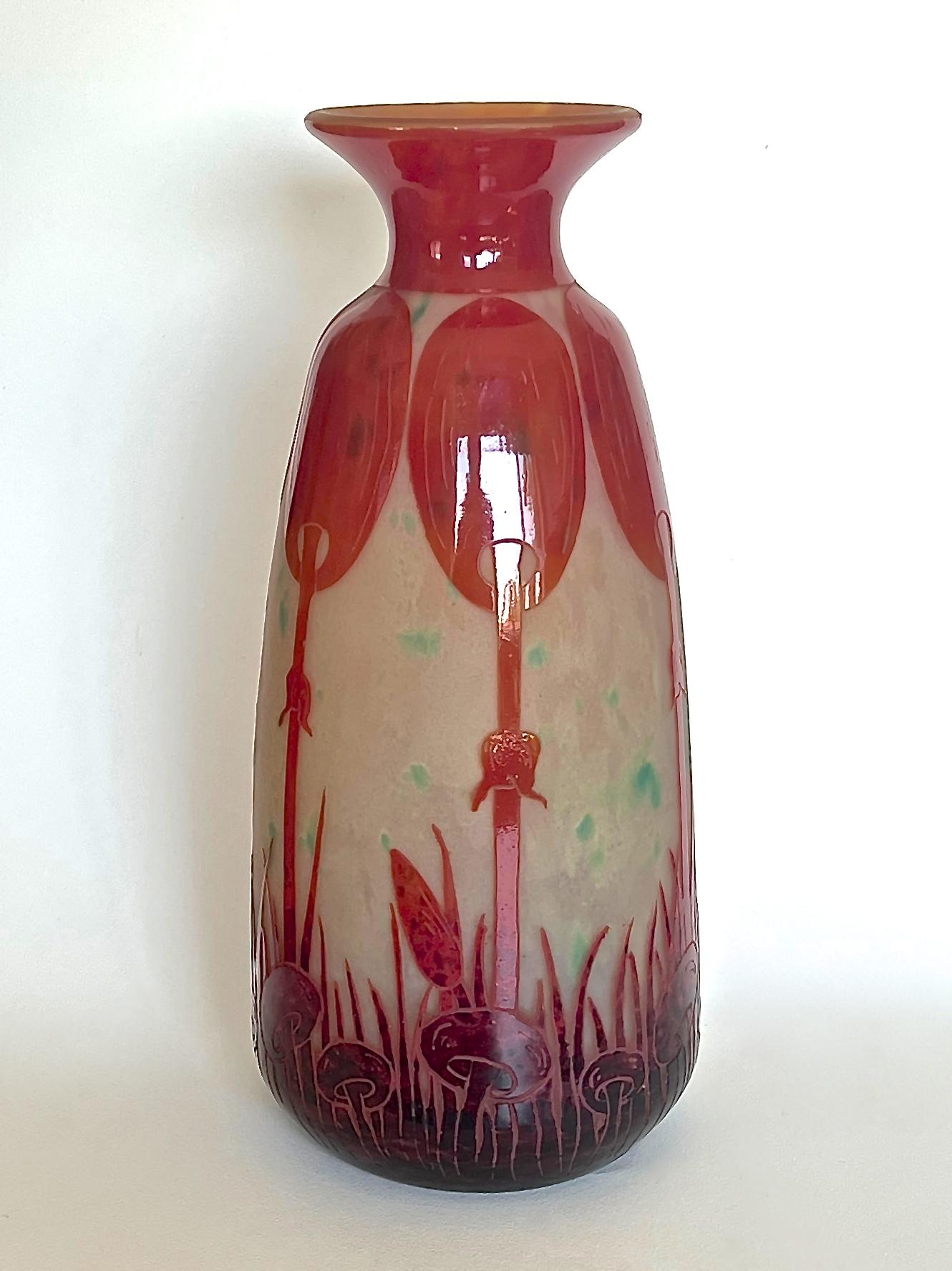 A stunning and large Art Déco cameo glass vase of baluster form. The opaque yellow ground is textured and mottled sparingly with an acid-green. It is overlaid with a deep mottled maroon that graduates upwards to a bright red then acid-etched & wheel
