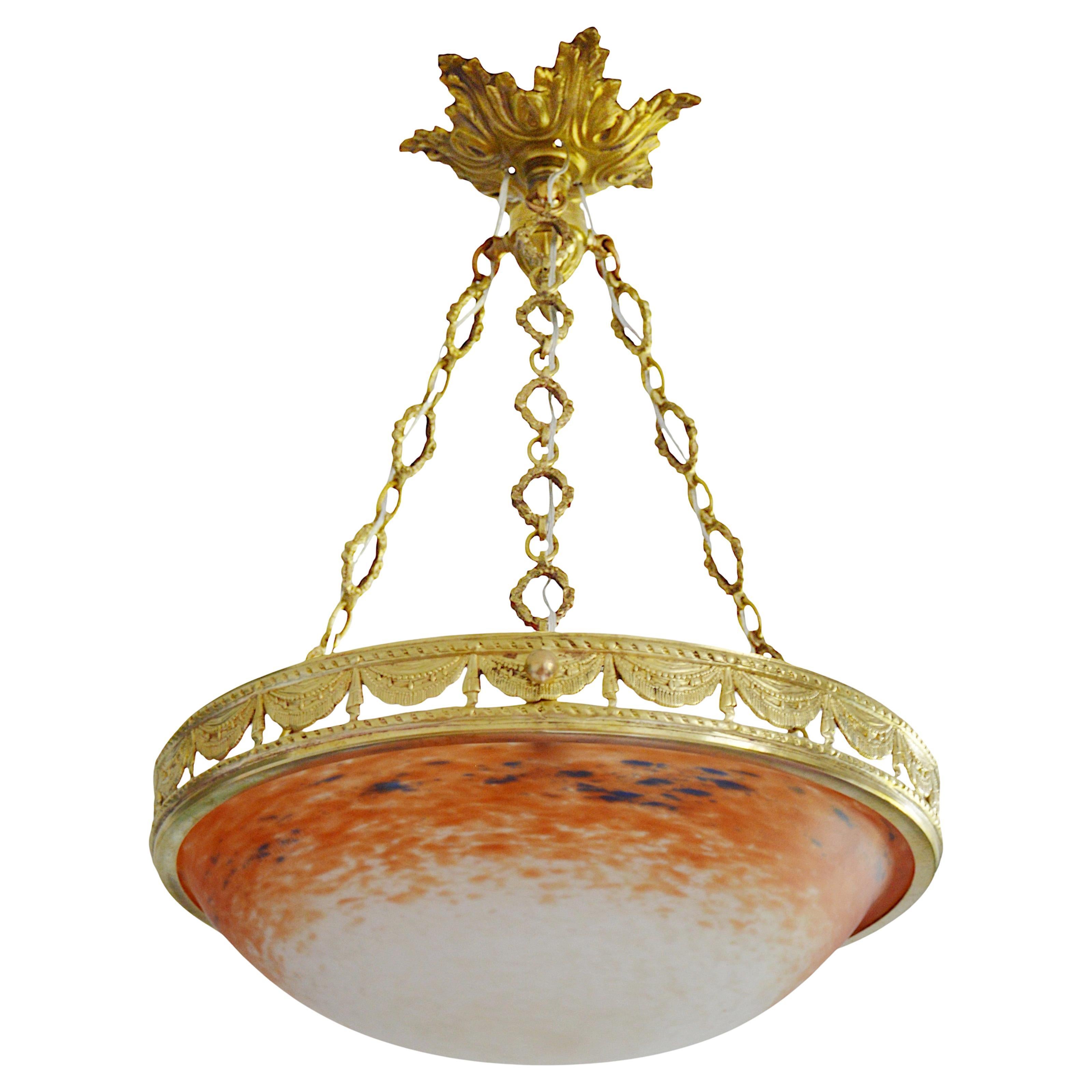 French Art Deco Pendant Chandelier by Charles Schneider, Epinay-sur-Seine (Paris), 1920. This exquisite chandelier features a mottled glass shade, with powders applied between two layers of glass, creating a striking visual effect. The shade is