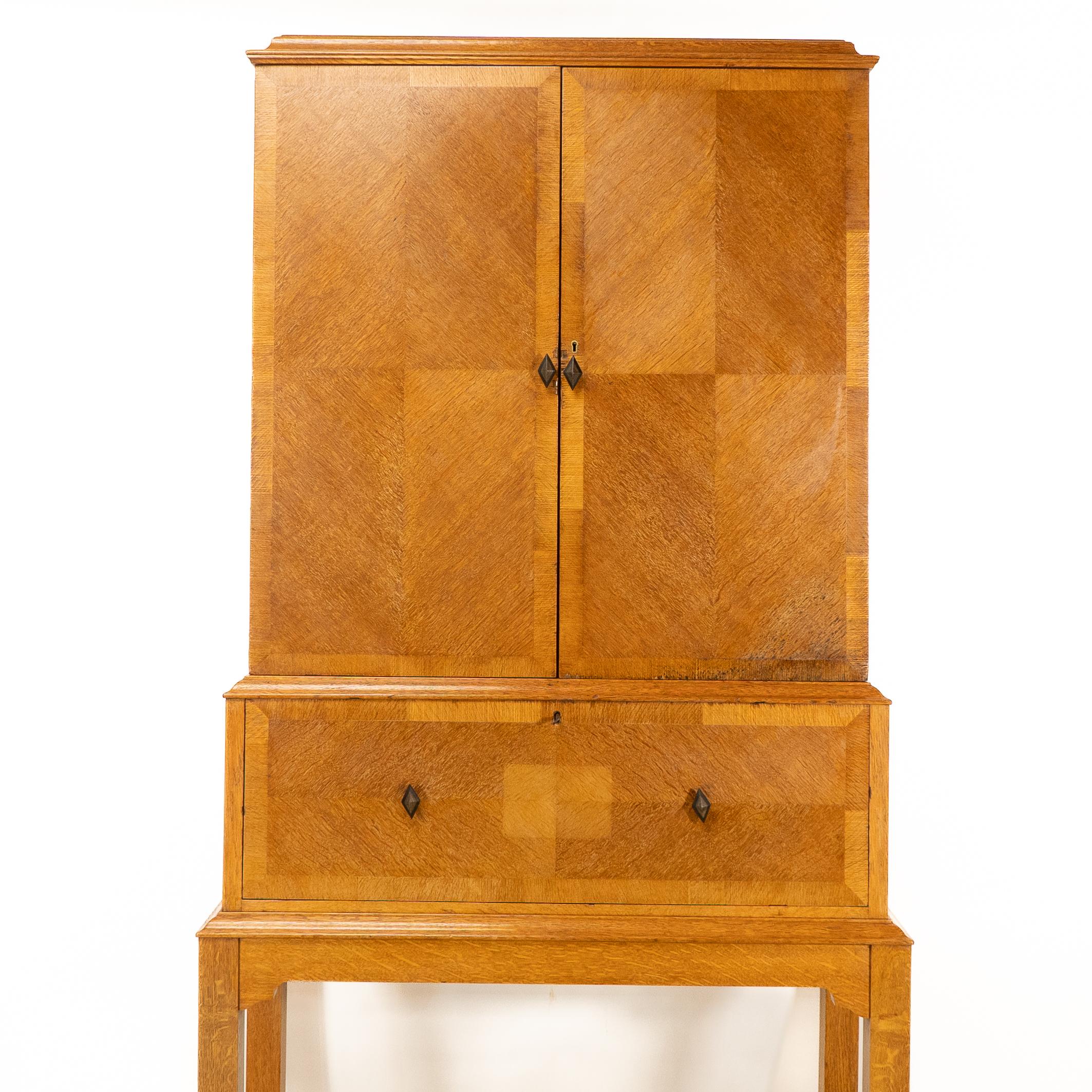 English Charles Spooner Arts & Crafts Oak secretaire Cabinet with Serpentine Stretchers For Sale