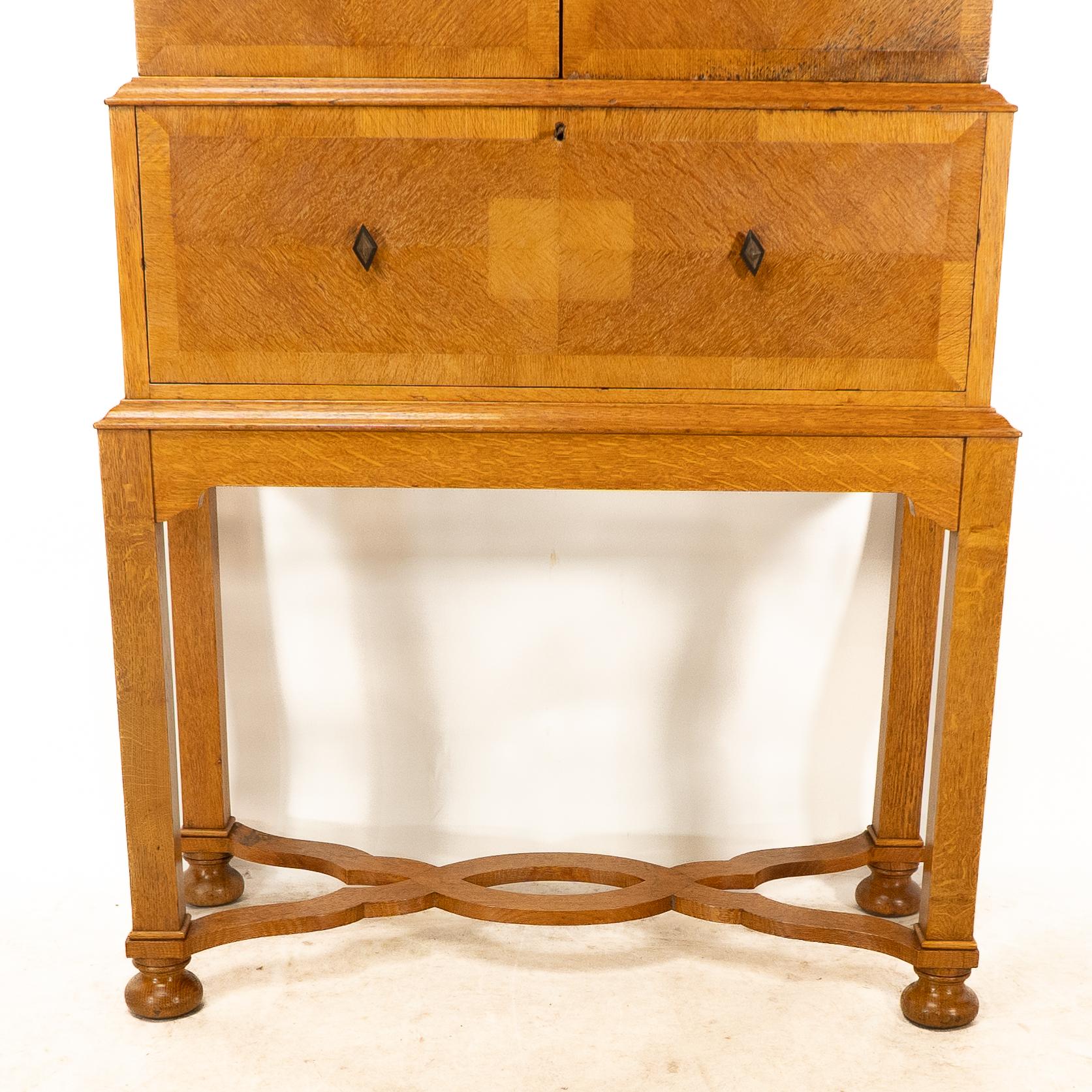 Early 20th Century Charles Spooner Arts & Crafts Oak secretaire Cabinet with Serpentine Stretchers For Sale