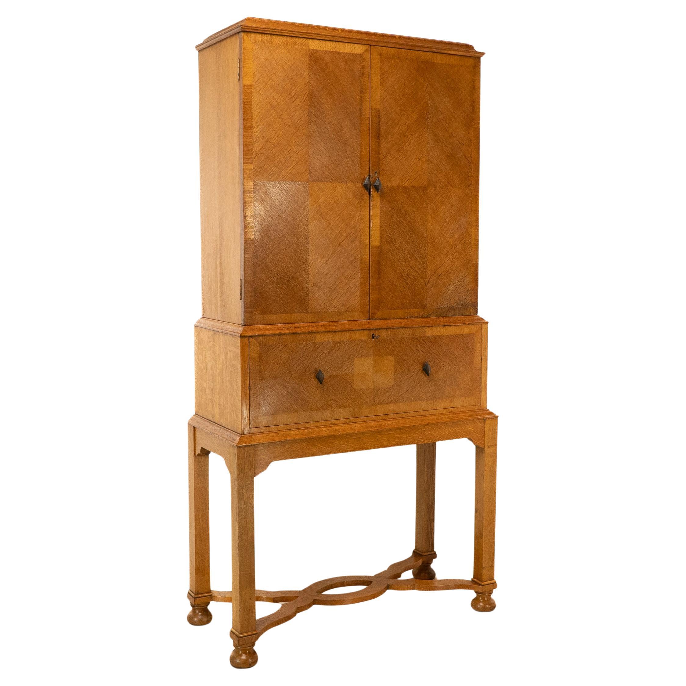 Charles Spooner Arts & Crafts Oak secretaire Cabinet with Serpentine Stretchers For Sale