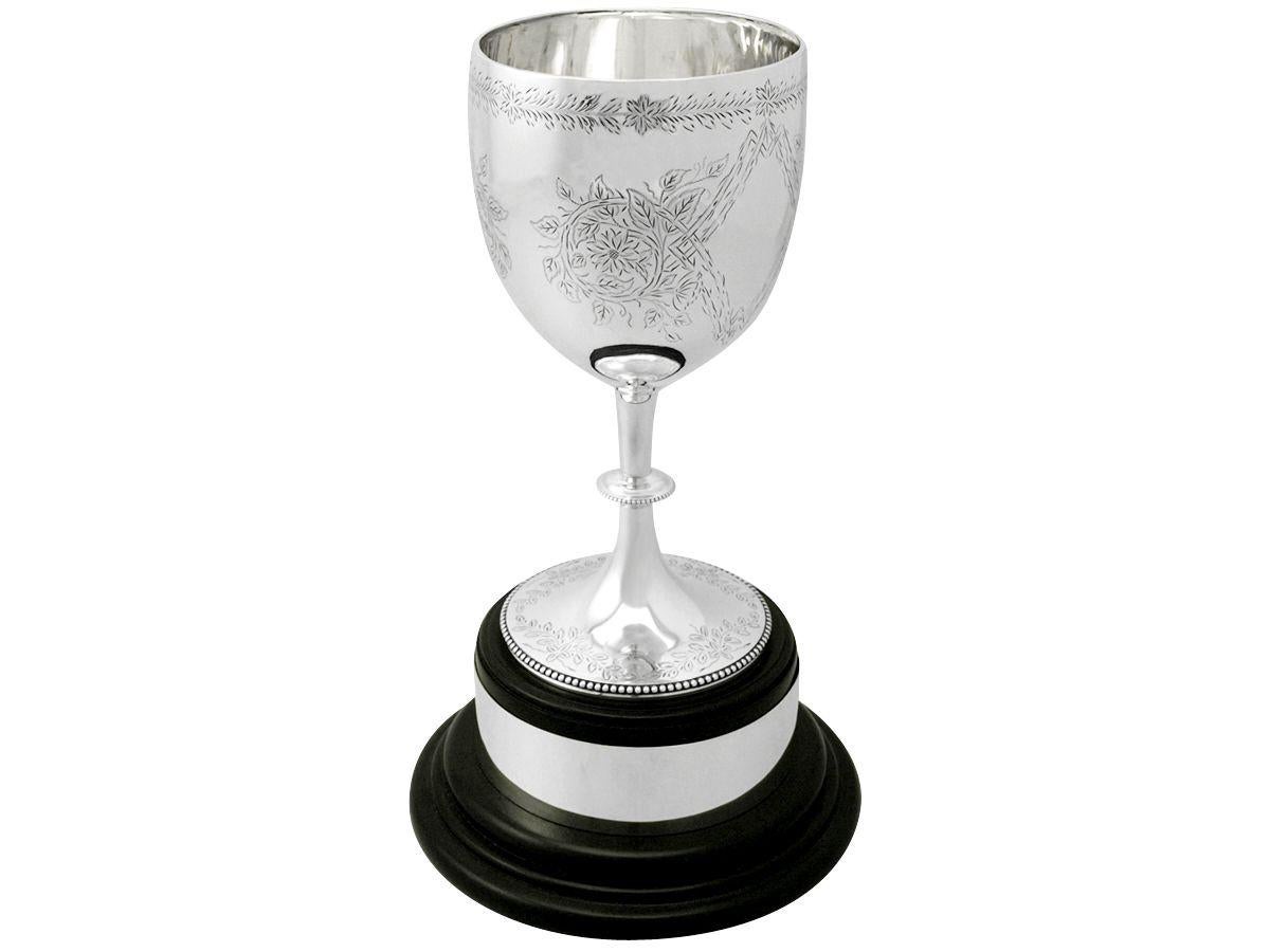 A fine and impressive antique Victorian English sterling silver presentation cup made by Charles Stuart Harris; part of our presentation silverware collection.

This fine antique Victorian sterling silver presentation cup has a plain circular bell