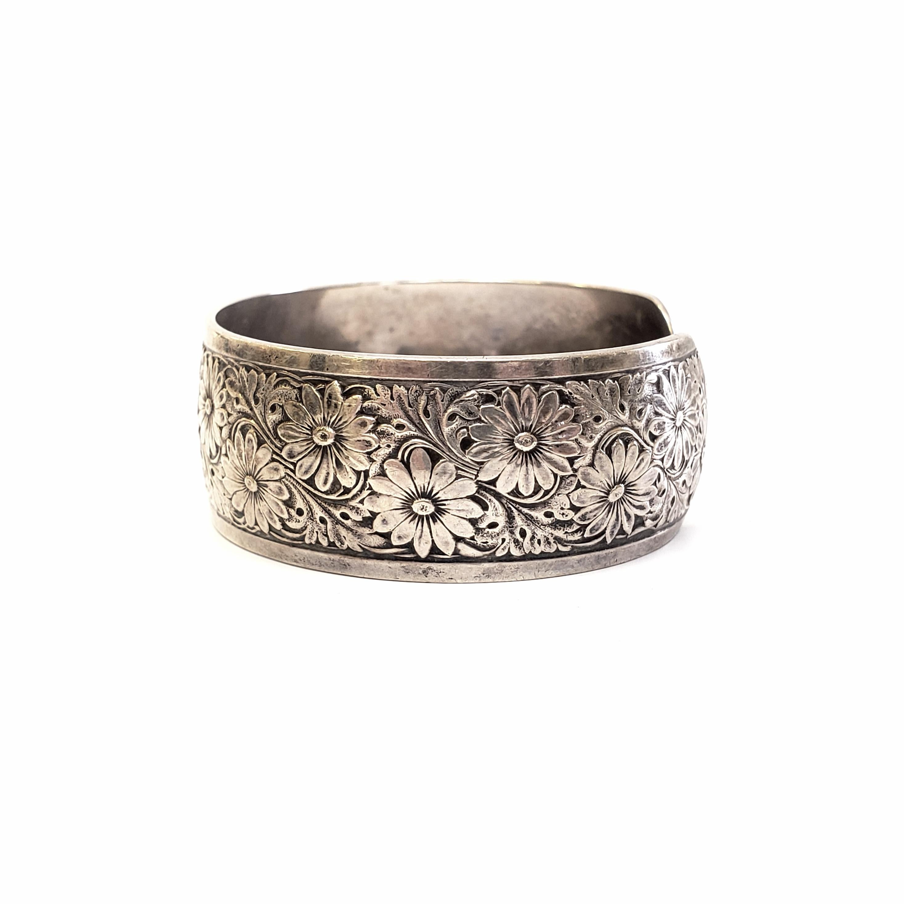 Sterling silver cuff bracelet designed by Charles Thomae.

Charles Thomae of Attleboro, MA manufactured sterling novelties from 1920. This cuff bracelet features a beautiful floral and scroll motif.

Measures 6 1/8