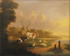 A river landscape, with cattle and sheep resting, a windmill beyond
