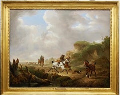 Riders and dogs on a country path