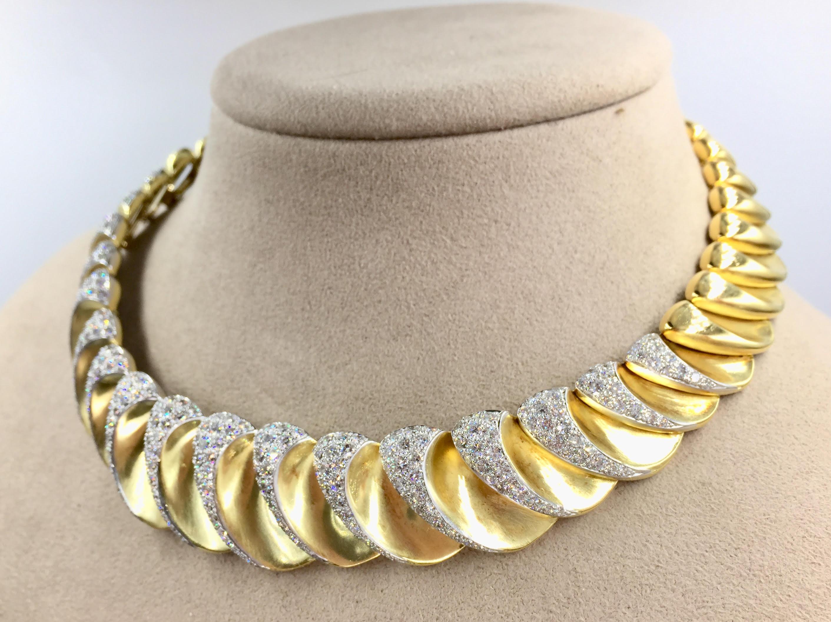 Handcrafted with extraordinary quality by Charles Turi, this unique and stunning collar necklace is expertly pavé set with 12.50 carats total weight of high quality diamonds - approximately F color, VS clarity. The solid scalloped 18k yellow gold