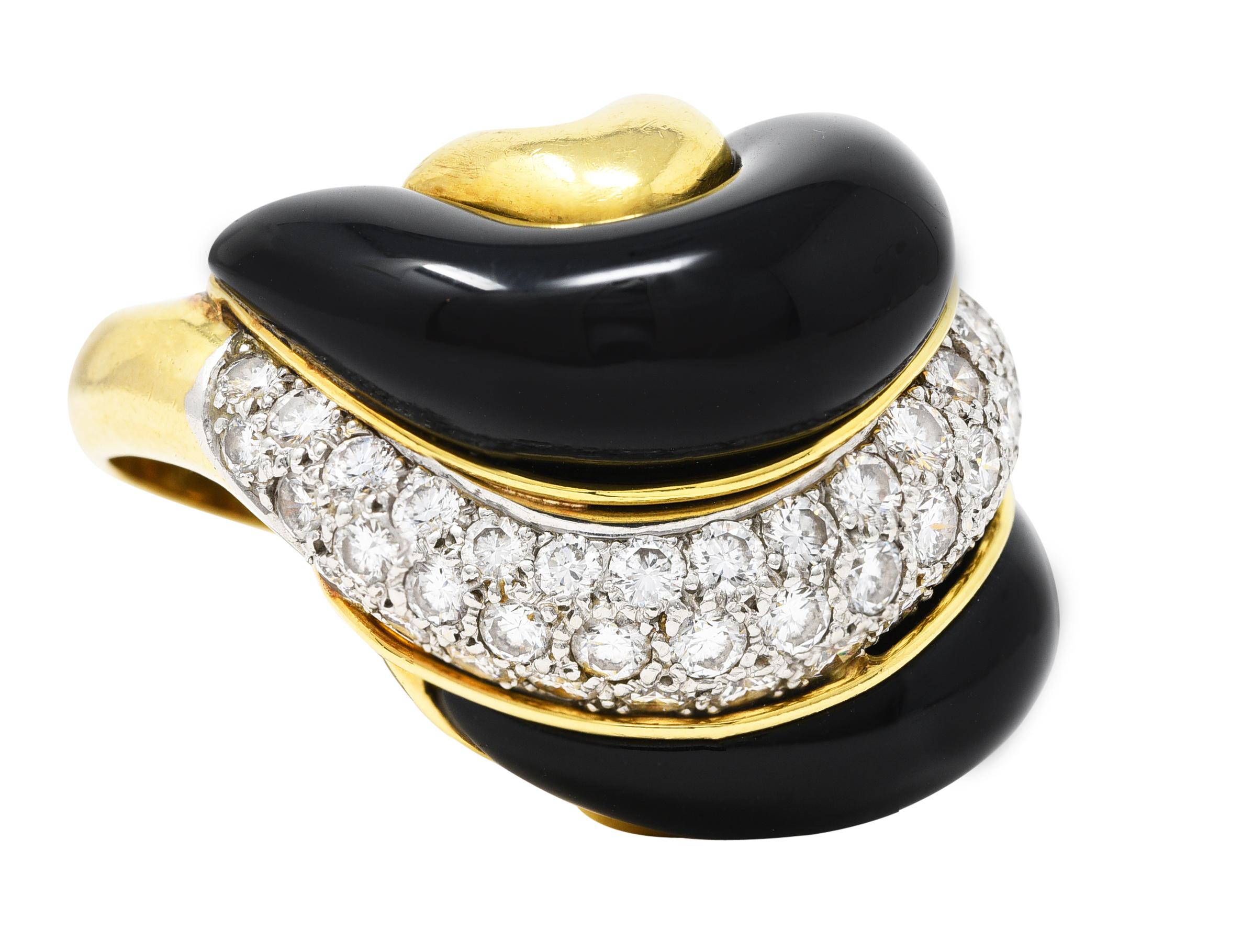 Designed as a domed form with a segmented swirl motif centering a row of round brilliant cut diamonds
Pavé set in platinum and weighing approximately 3.60 carats total - F/G color with VS2 clarity
Flanked by puffed rows of black enamel - glossy with