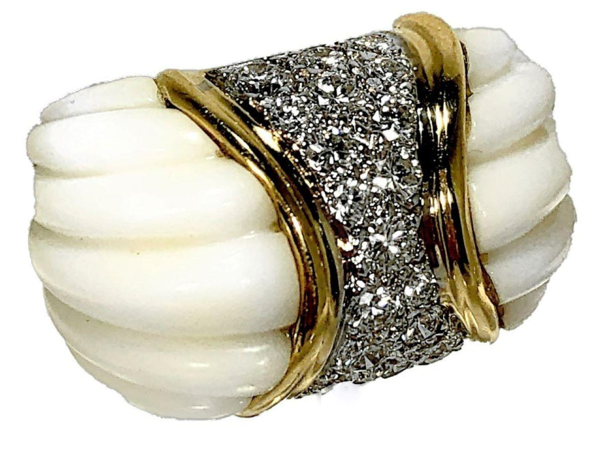 Created  by the venerated jewelry designer Charles Turi, this bold 18k yellow gold cocktail ring features a swath of high quality, pavee set diamonds at it's center, framed by fluted white coral shoulders. The total approximate diamond weight is