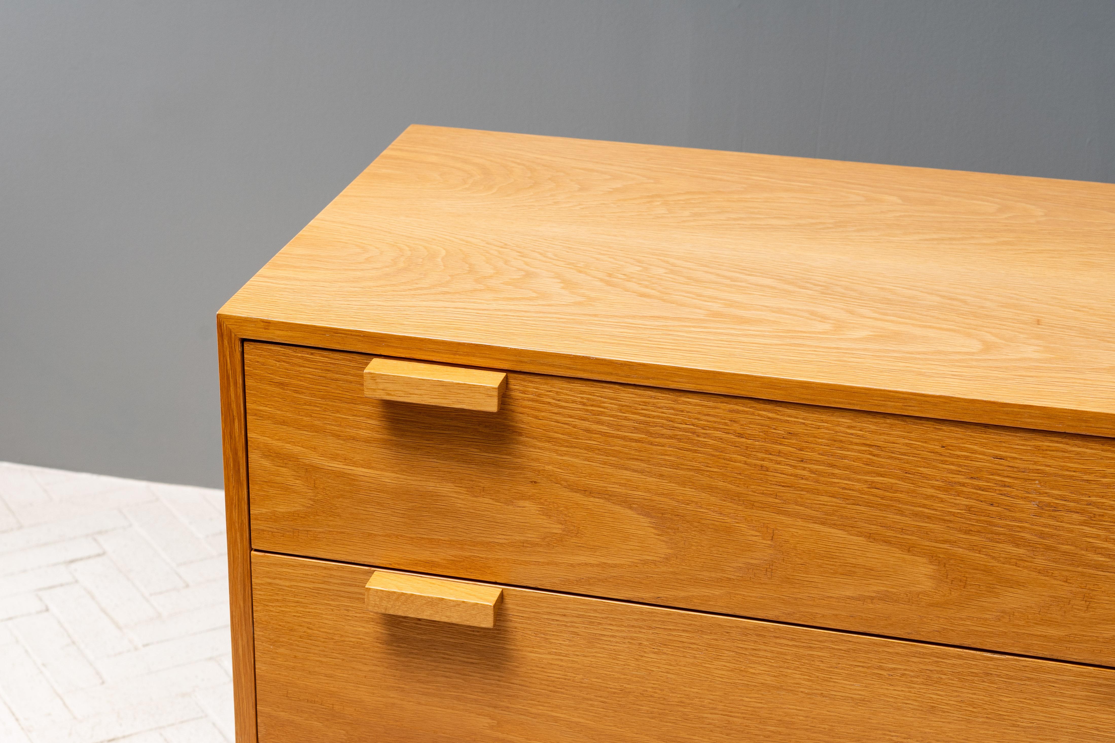 USA, ca. 1970s. A supremely useful bureau or low dresser by Cambridge cabinetmaker Charles Webb. Features sturdy oak construction with eight deep drawers - each finished with Webb’s signature rectangular handles. Top two drawers include original