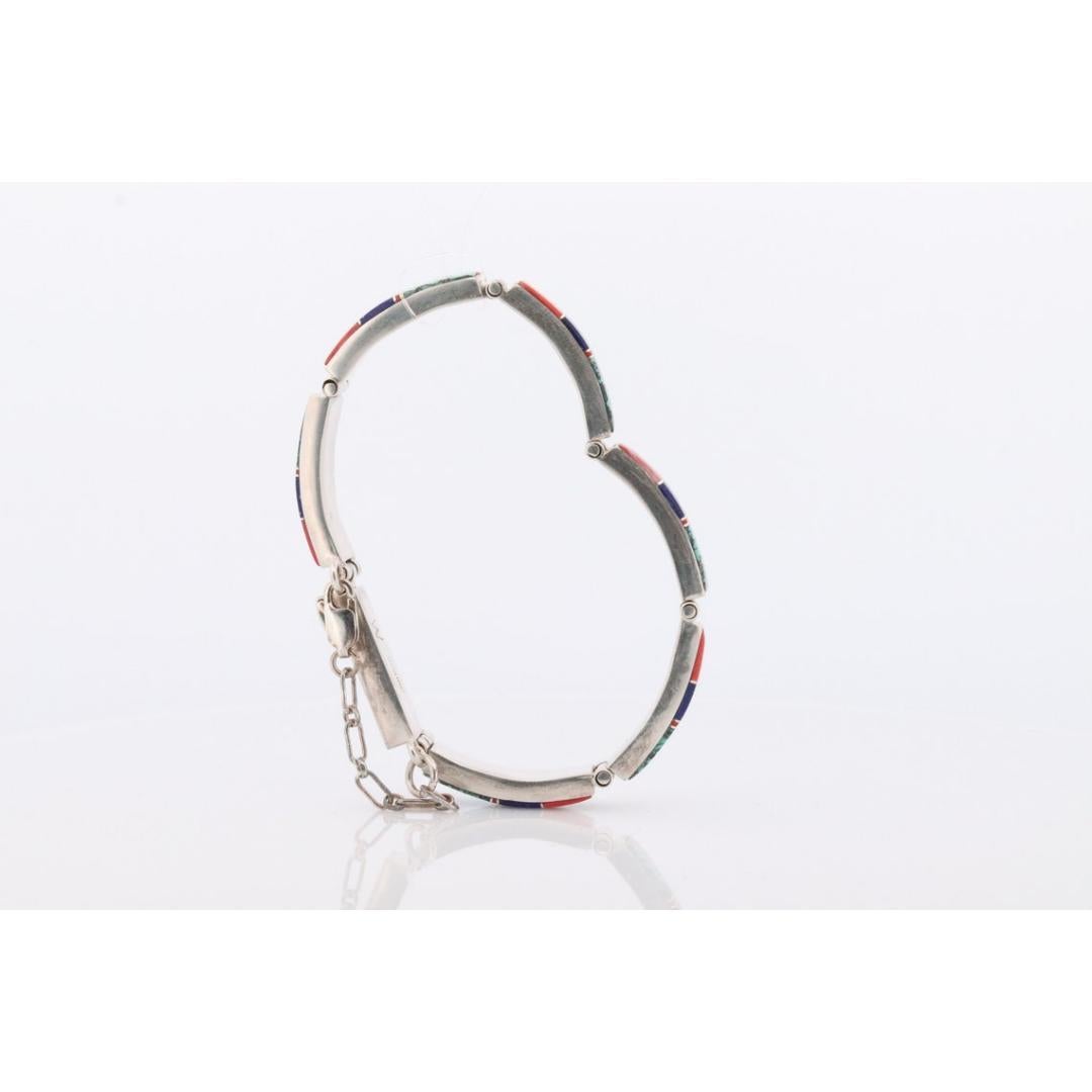 Vintage
Materials: Stone
Gemstone: Turquoise
Closure: Slide lock

Jewelry style: Boho & hippie

Sterling Silver Sections Bracelet. Turquoise Coral Lapis Lazuli Inlay

Charles Willie made. Certificate of Authenticity included.

Native American