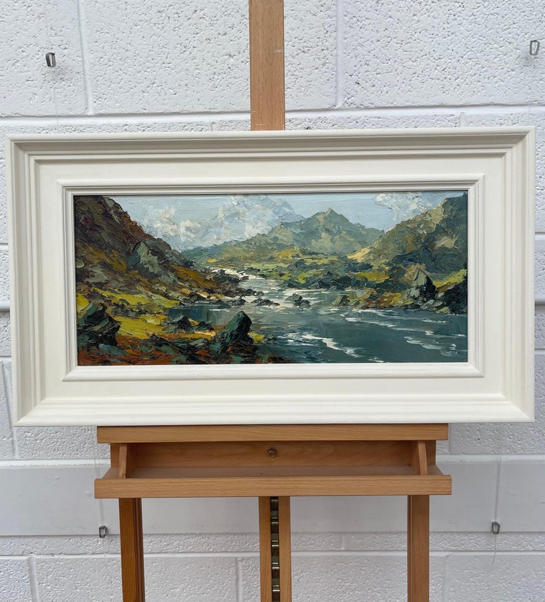 Impasto Oil Painting of River Mountain Scene in Wales by British Artist Charles Wyatt Warren (1908-1993)

Art measures 21 x 9 inches 
Frame measures 26 x 14 inches 

Charles Wyatt Warren (1908-1993) was a self-taught painter and an enthusiastic