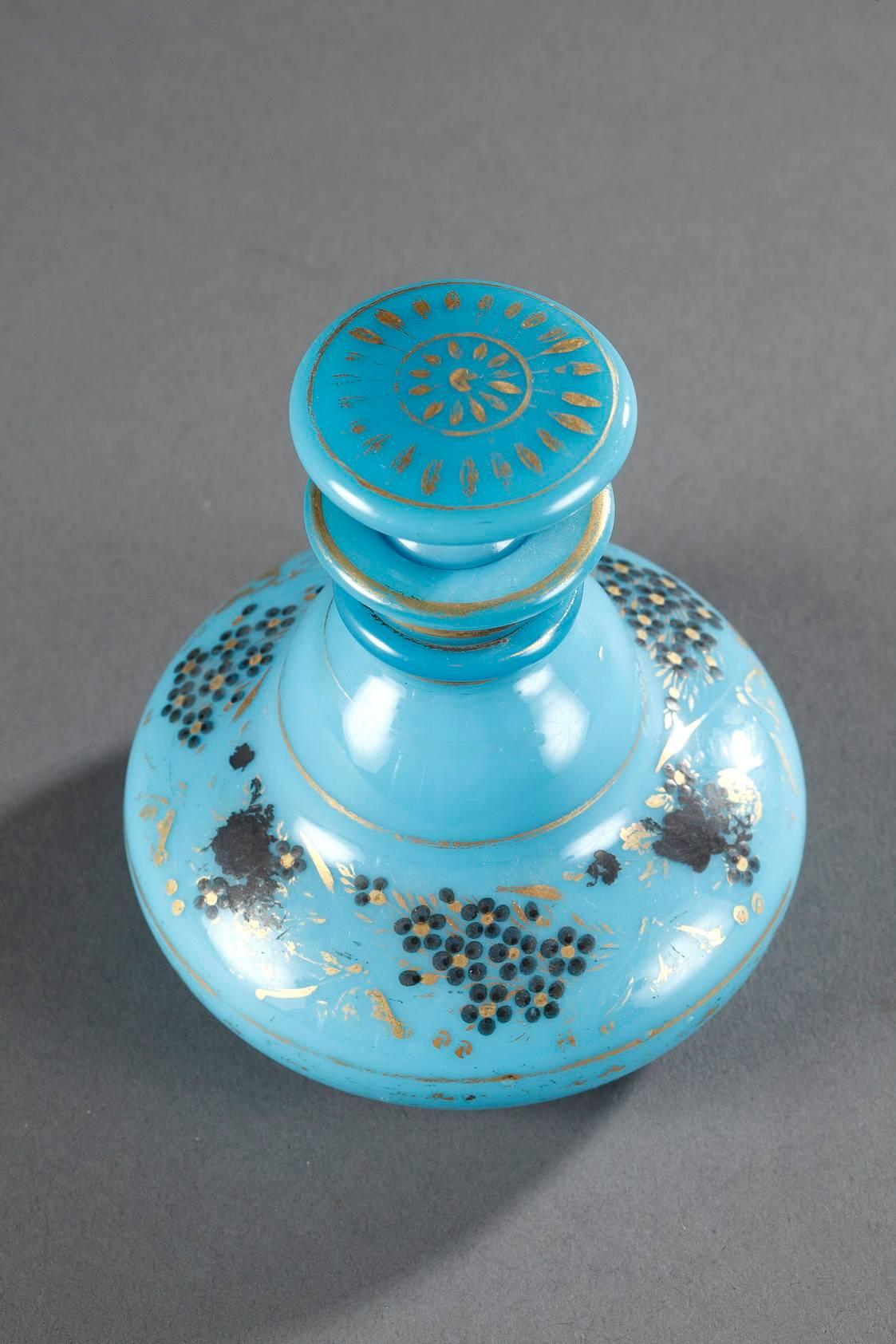 Turquoise blue opaline flask and its flattened stopper that is decorated with a radiant pattern. Gold stripes decorate the rim and body, alongside gilt, silvered, and blue bouquets of roses and forget-me-nots. Produced by the Jean-Baptiste Desvignes