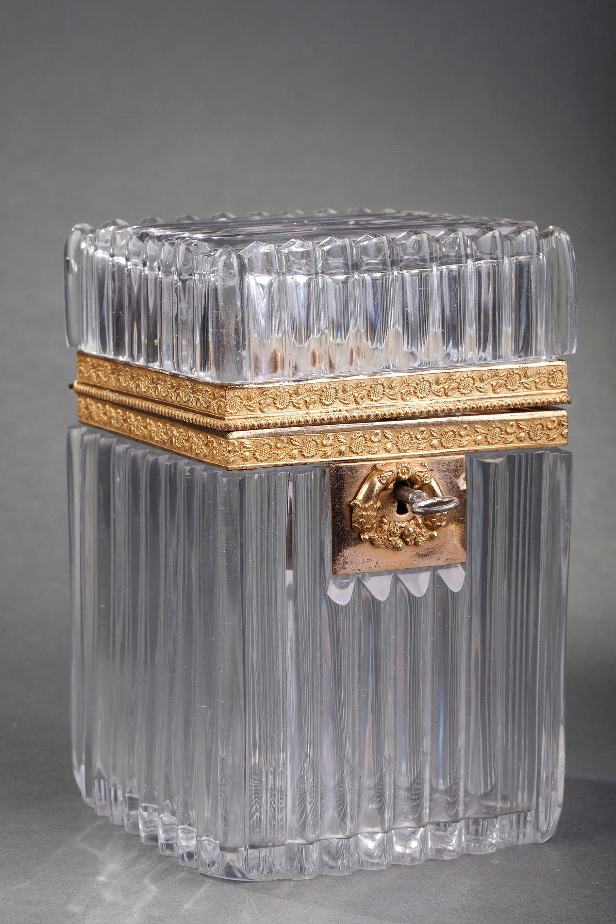 A rectangular cut-crystal casket with a 