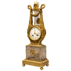 Pendule de cheminée en verre taillé et bronze doré Charles X