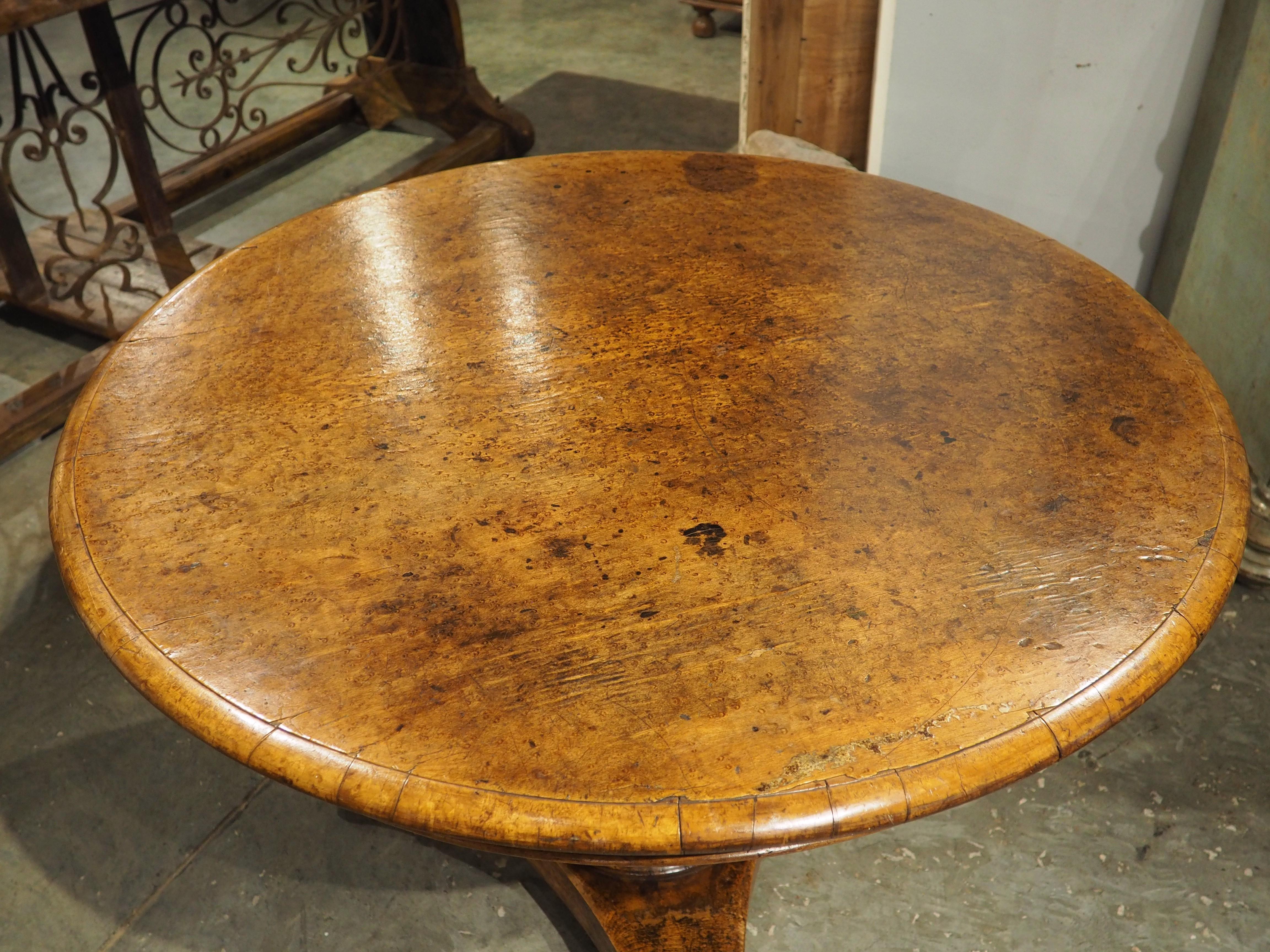 More information coming soon…

A beautiful French center table, dating to circa 1830.  From the period of Charles X, the table has a lovely honey brown veneer of burl maple.  The elegant fluted pedestal with a leaf cup base is supported by a