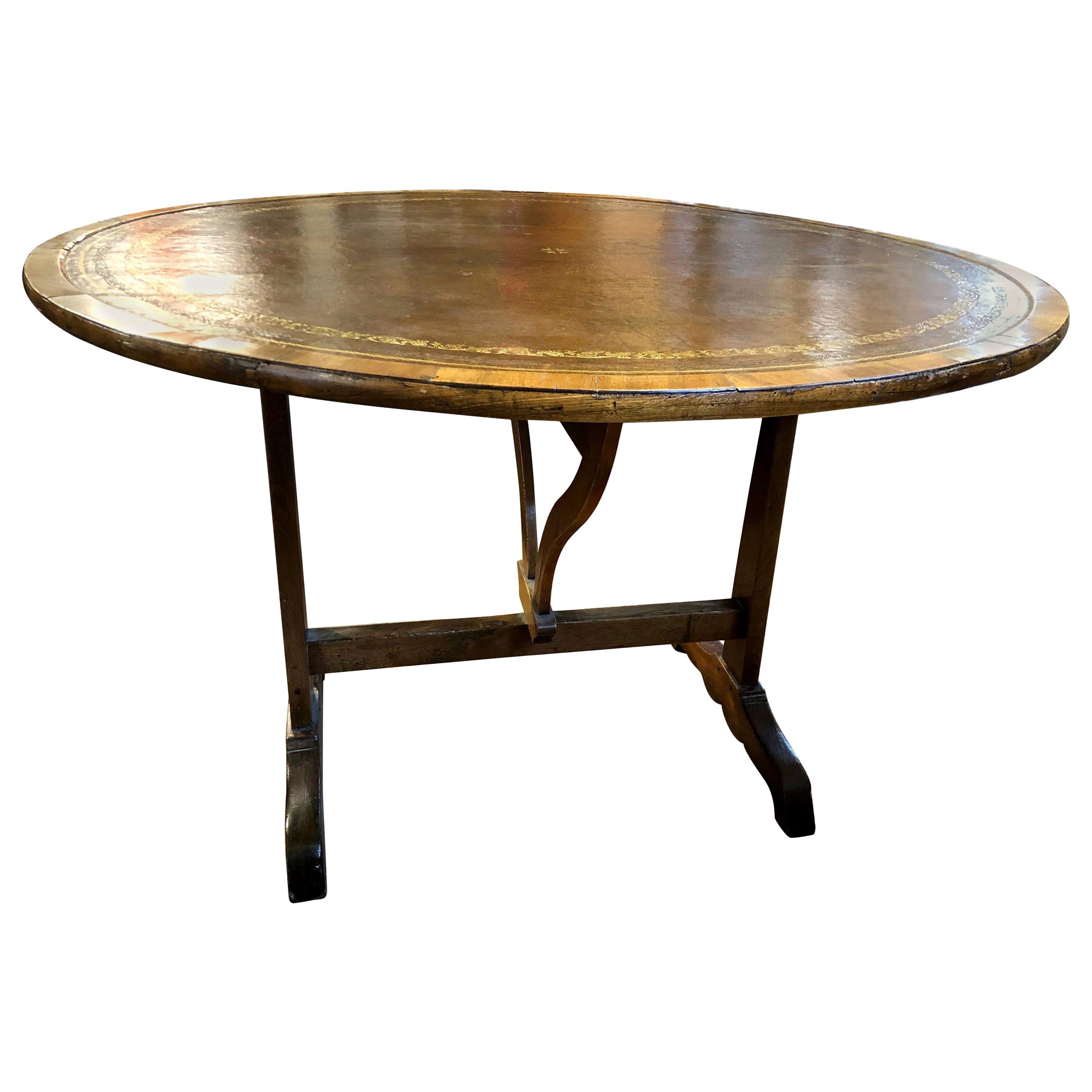 Charles X French Provincial Tooled Leather Tilt-Top Walnut and Oak Wine Table