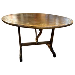 Charles X French Provincial Tooled Leather Tilt-Top Walnut and Oak Wine Table