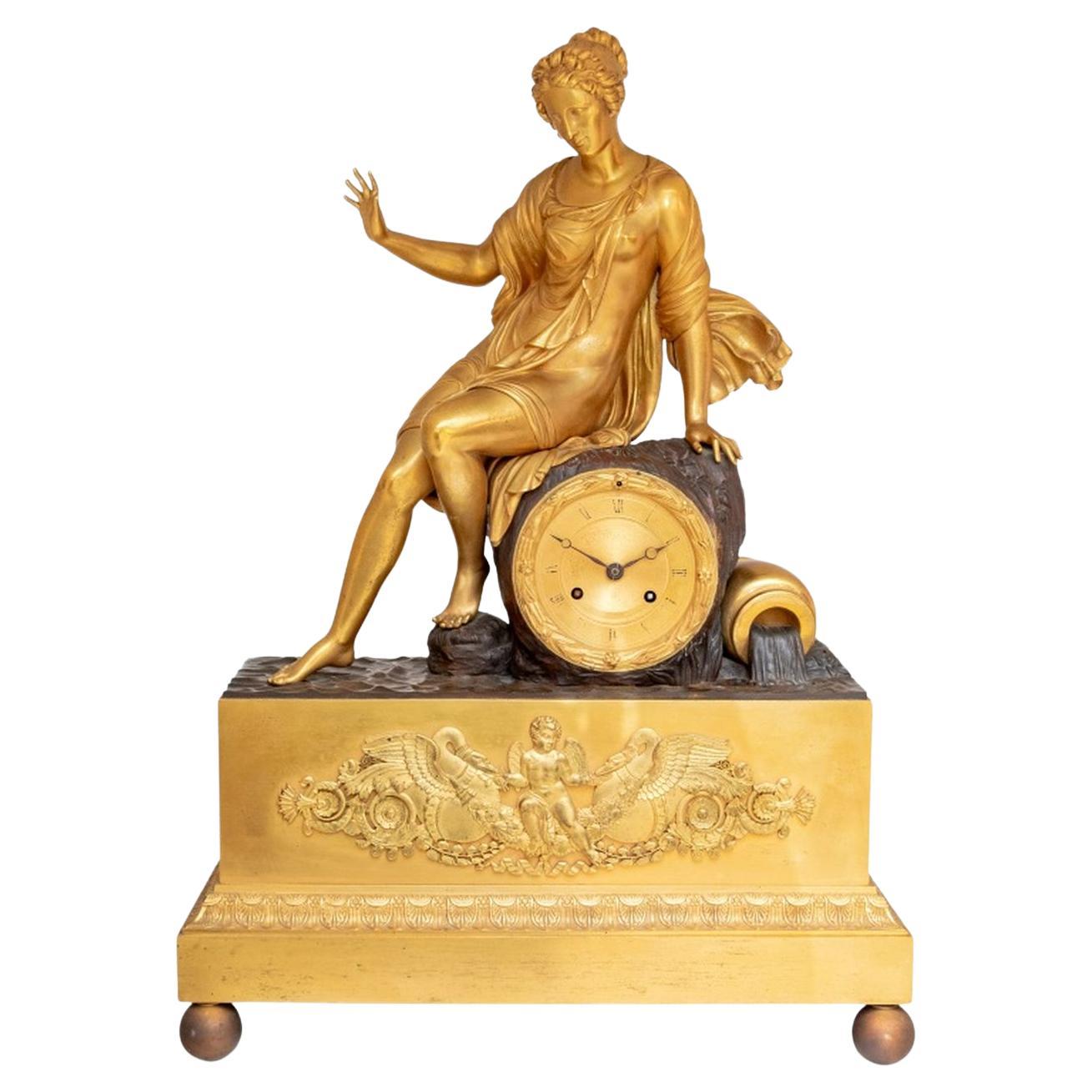 Charles X Gilt and Patinated Bronze Figural Clock
