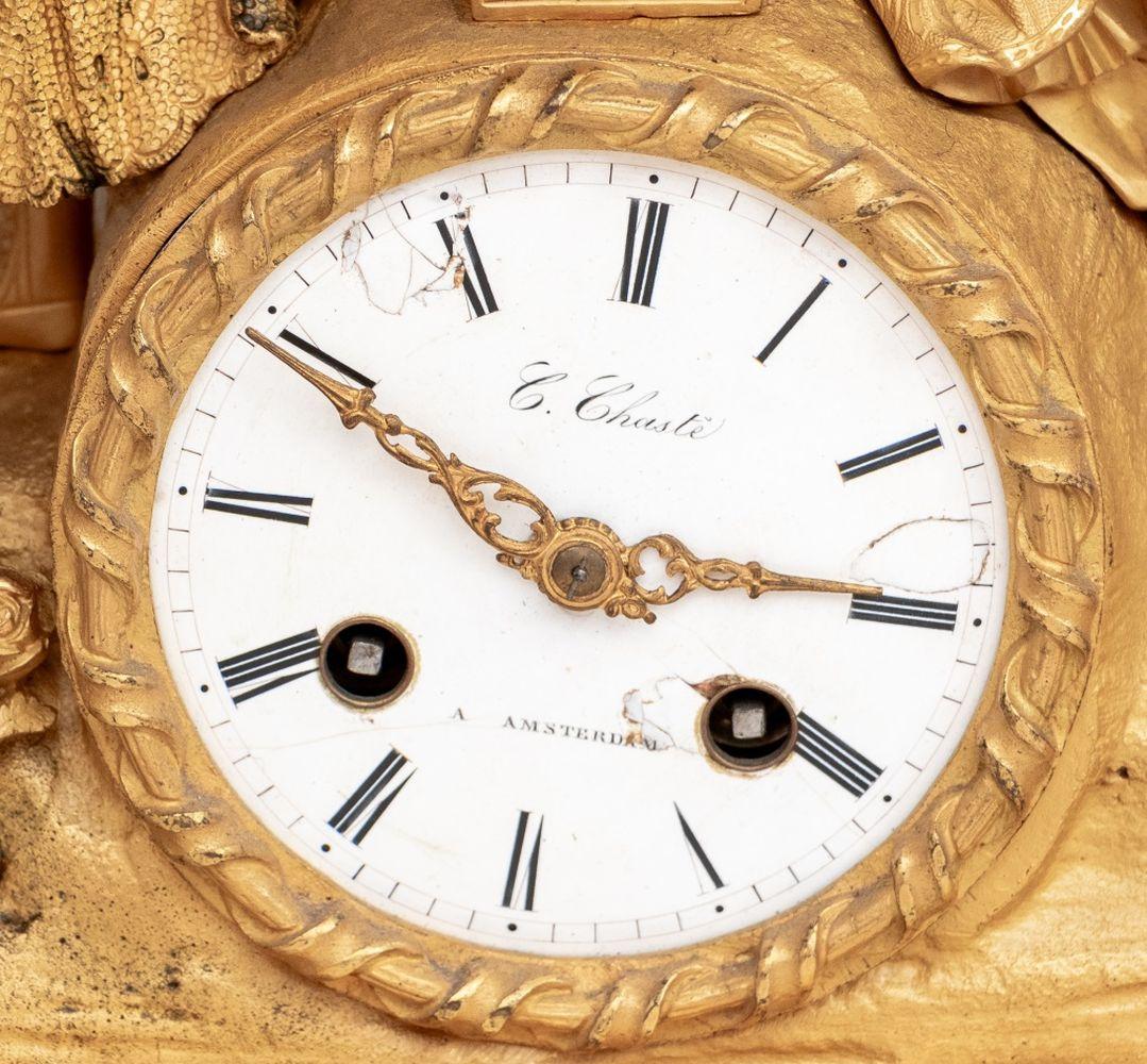 Charles X Gilt Bronze Figural Clock, circa 1830, the circular enamel dial signed 