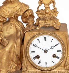 Reloj de chimenea figurado Charles X de bronce dorado
